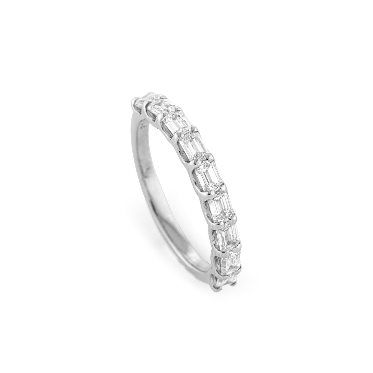 End to End Emerald Cut Diamond Ring in gold with continuous line of nine emerald cut diamonds.