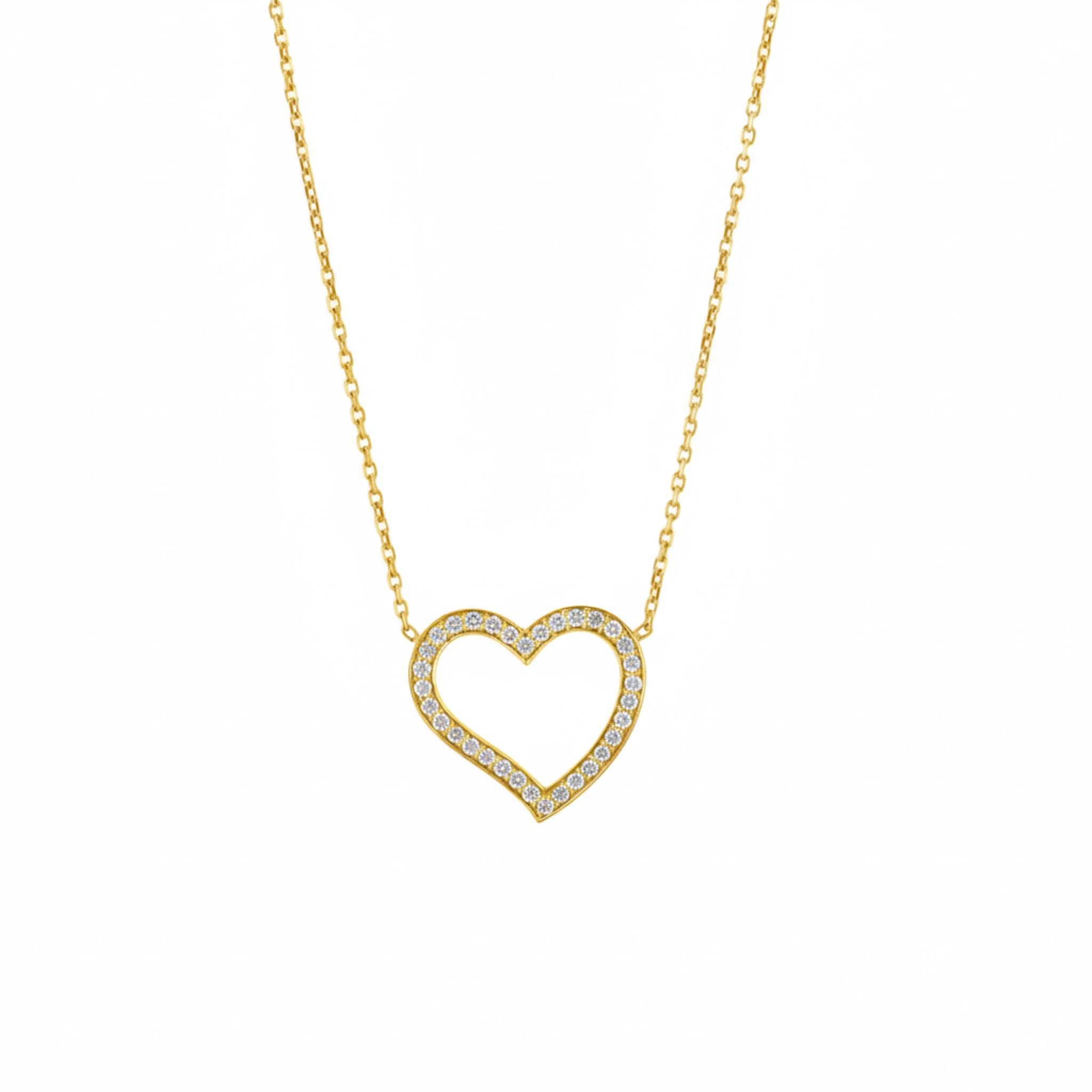 Amélie heart pendant necklace in 18ct yellow gold with round brilliant diamonds, symbolising modern romance.