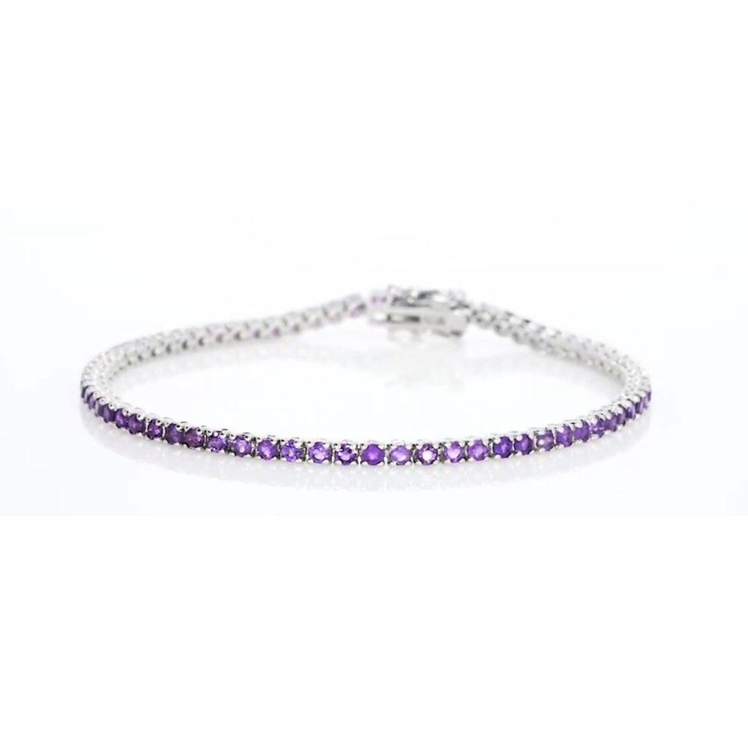 Amethyst tennis bracelet in 18ct white gold featuring rich purple gemstones, perfect for elegant occasions.