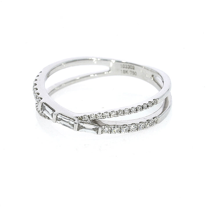 White gold colour, modern criss-cross ring with 0.28cts of baguette and round cut luxury fine diamonds in set in 18ct gold.