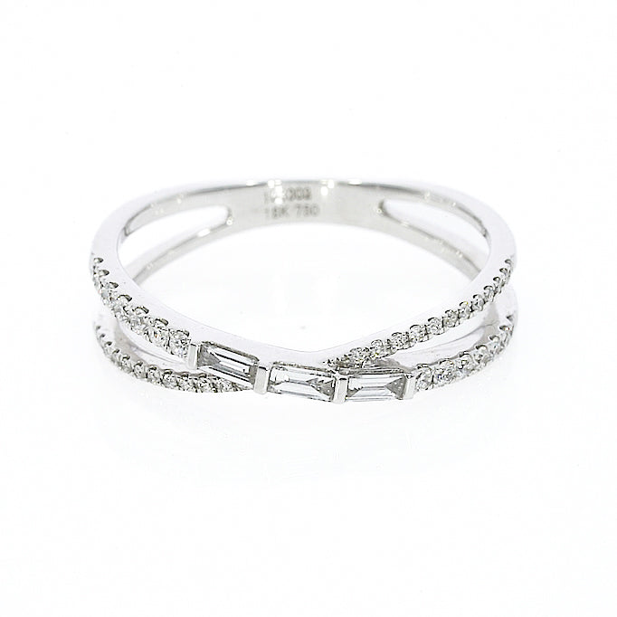 Modern criss-cross ring with 0.28cts of baguette and round cut luxury fine diamonds in white gold colour set in 18ct gold.