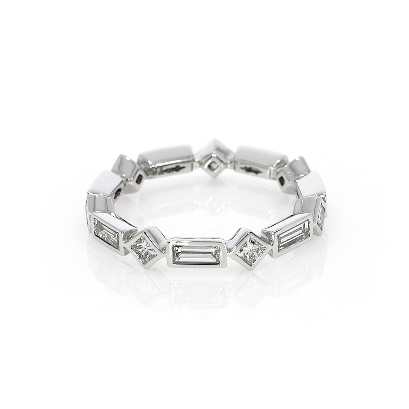 A crisp modern Baguette bezel ring with 1.35cts of princess and baguette cut certified natural diamonds.