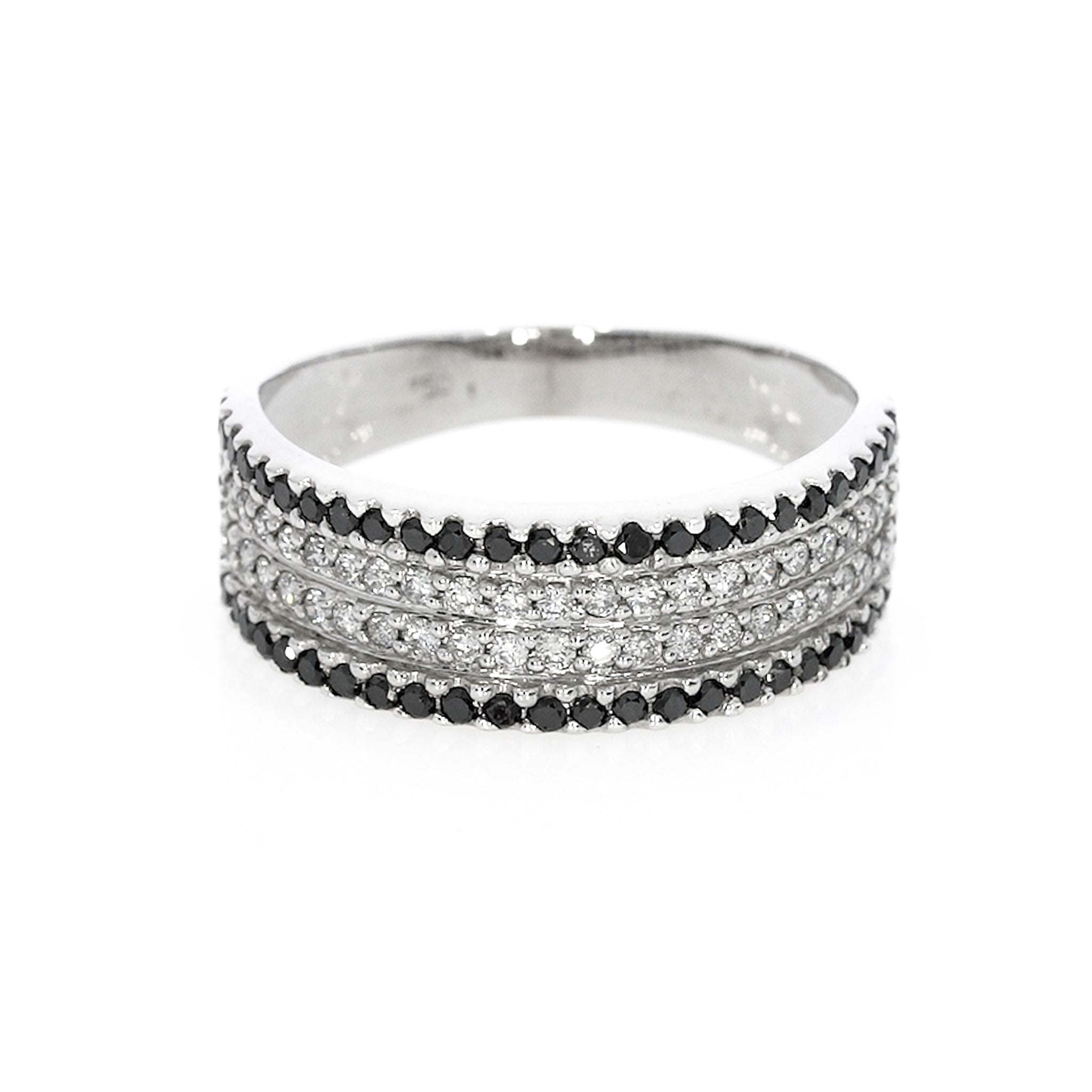 A feminine ring with natural certified black and white diamonds, set in 18ct gold, arranged in four rows.