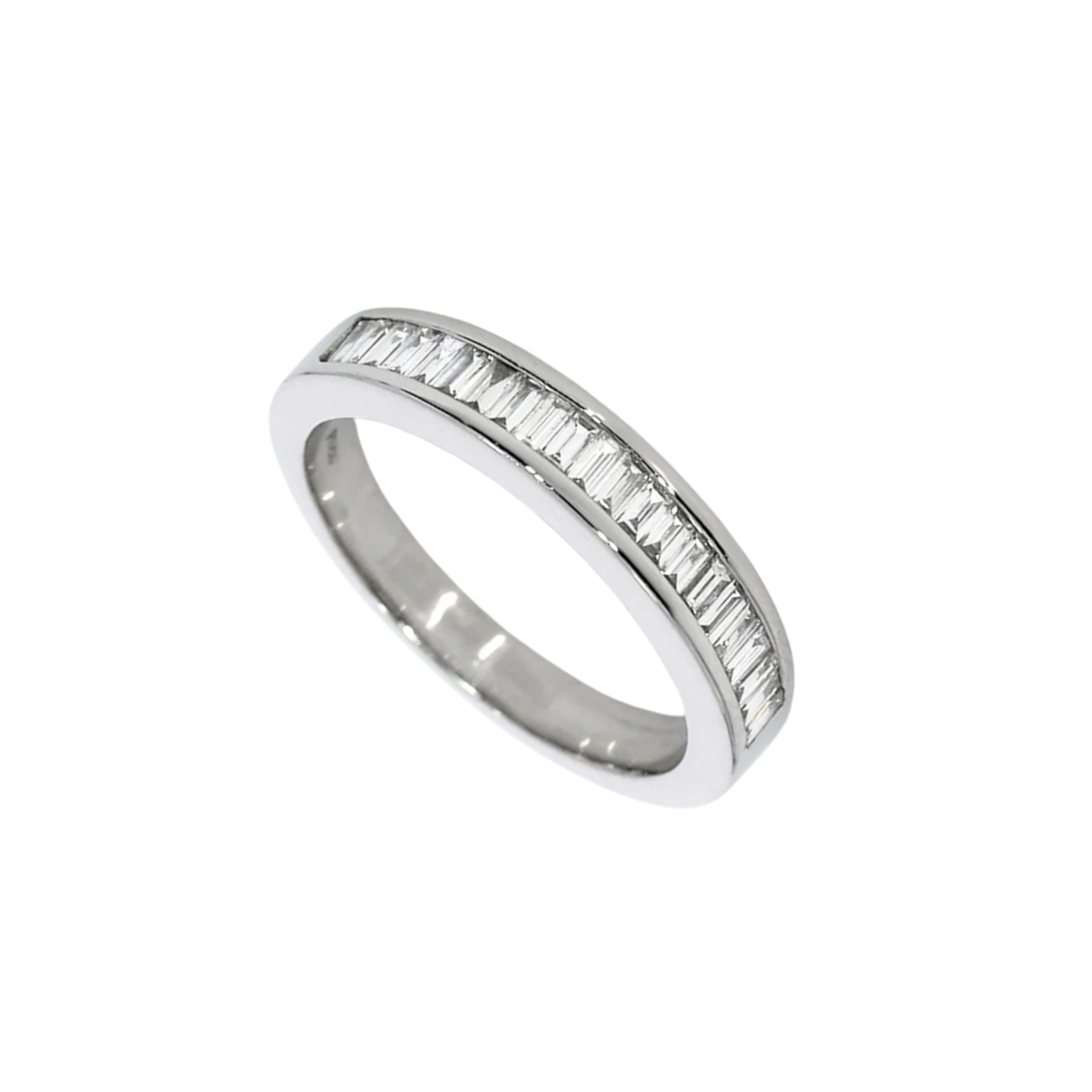 A white gold band ring featuring a channel setting of baguette-cut diamonds along the front edge, shown on a plain white background.