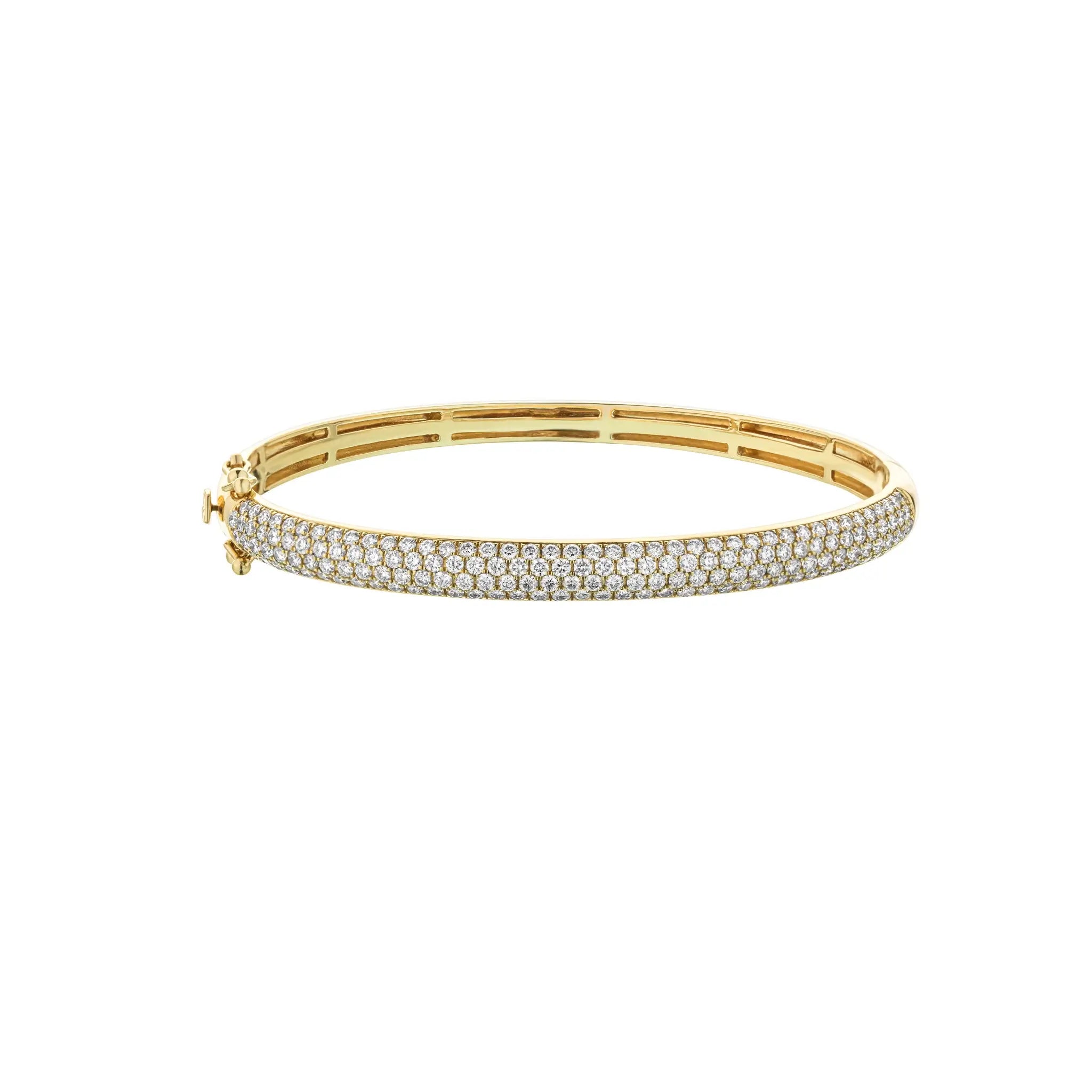 Gold bracelet with diamonds on a white background