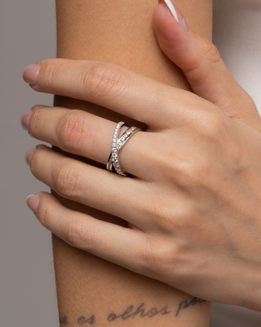 Coco Criss Cross Ring featuring certified diamond rings with round brilliant cut diamonds in platinum and 18ct yellow gold