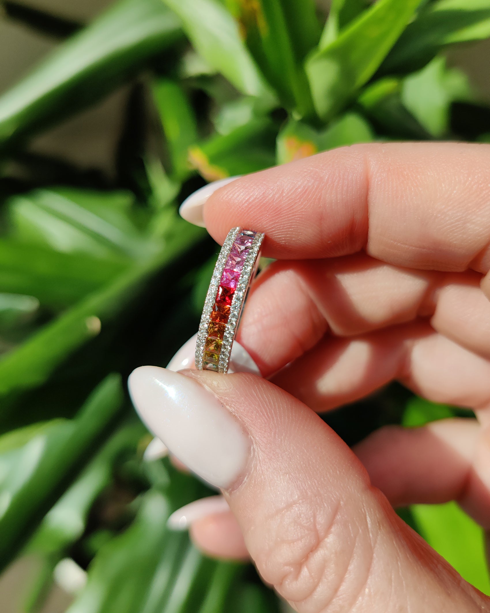 Elegant multi colour sapphire ring with diamonds, showcasing vibrant hues and exquisite craftsmanship.