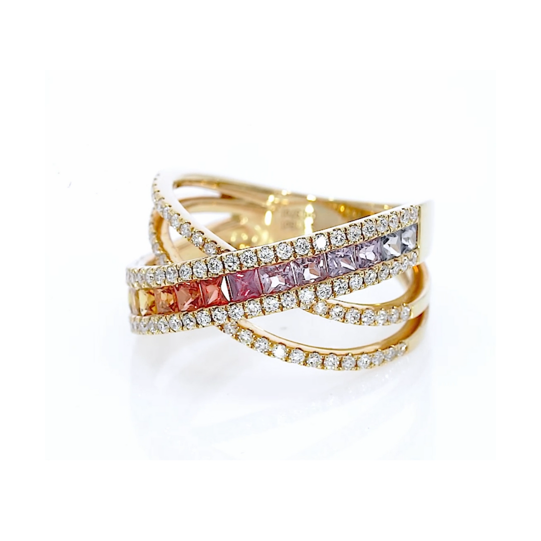 A captivating ring featuring fifteen coloured sapphires in green to blue hues, and round brilliant diamonds, set in 18ct gold.