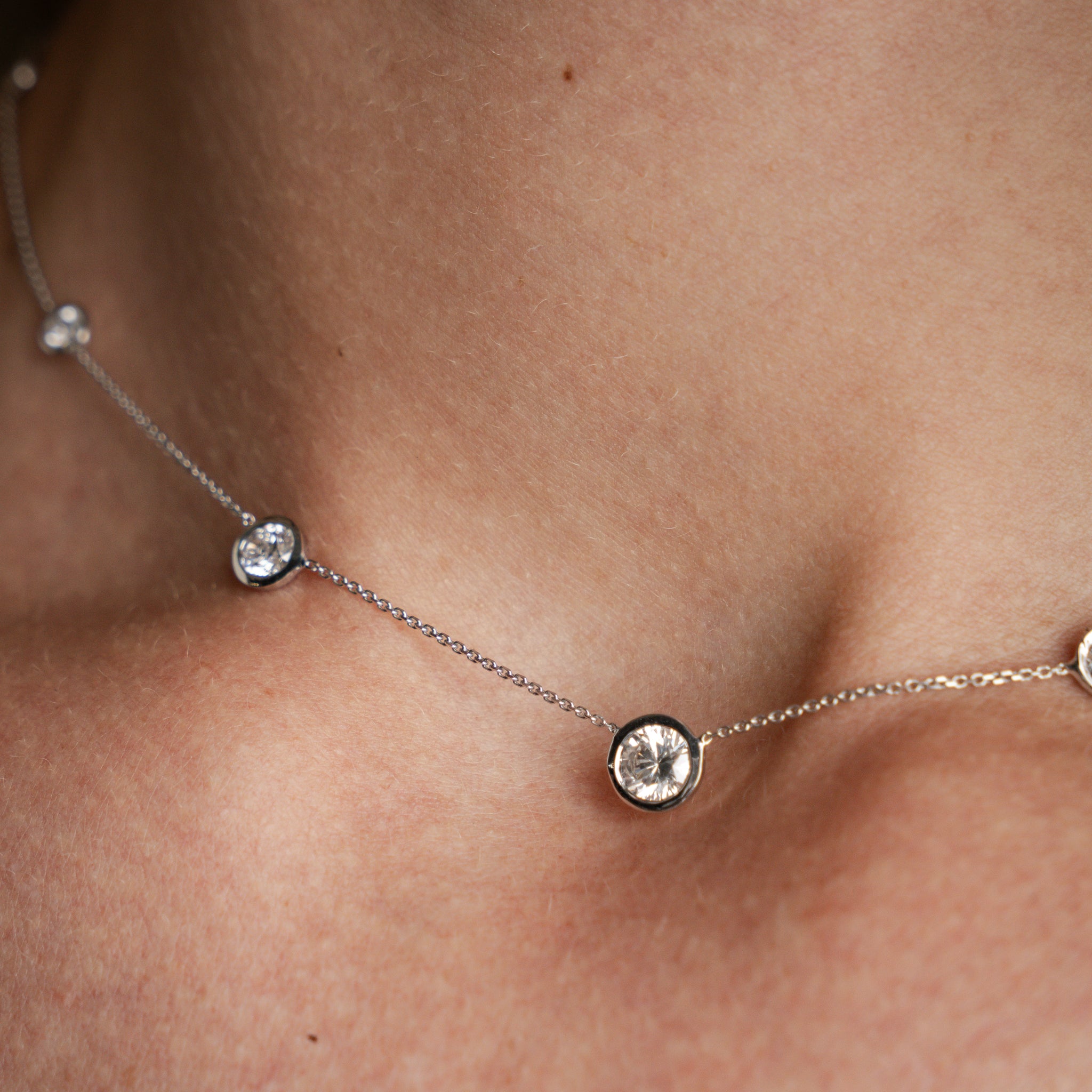 Constellation Necklace Graduating featuring round brilliant cut diamonds in delicate bezel settings.