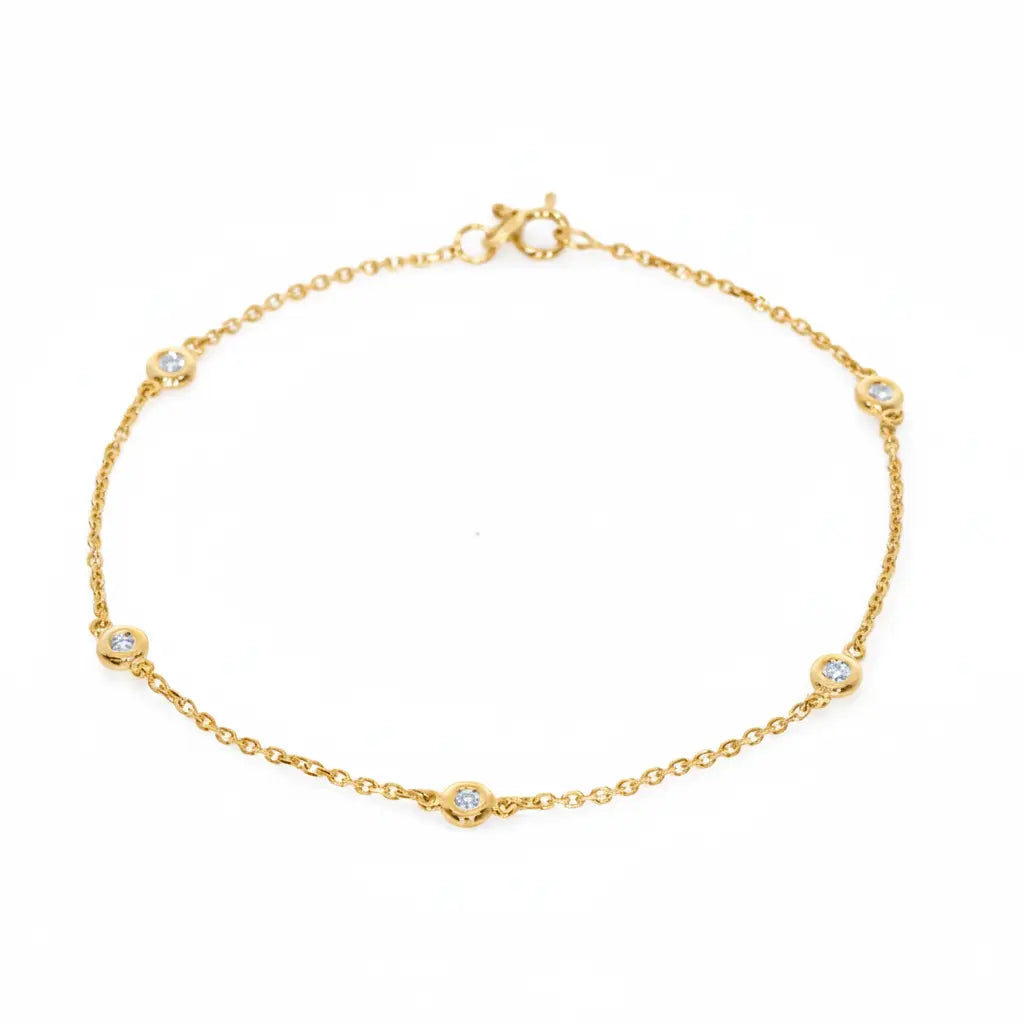 Feminine Constellation yellow gold bracelet featuring five certified diamonds set in fine bezel, perfect as a diamond bangle.