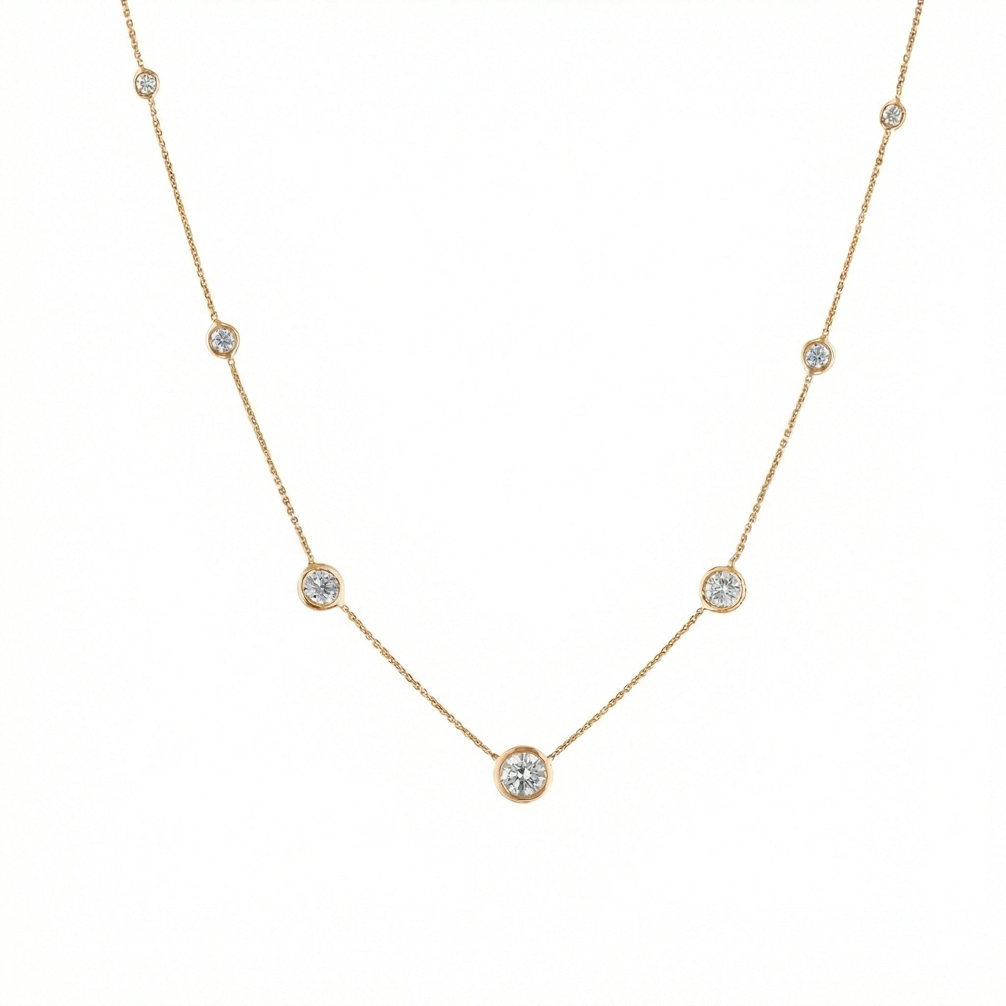 Constellation Necklace - Graduating featuring delicate bezel set diamonds in yellow gold.