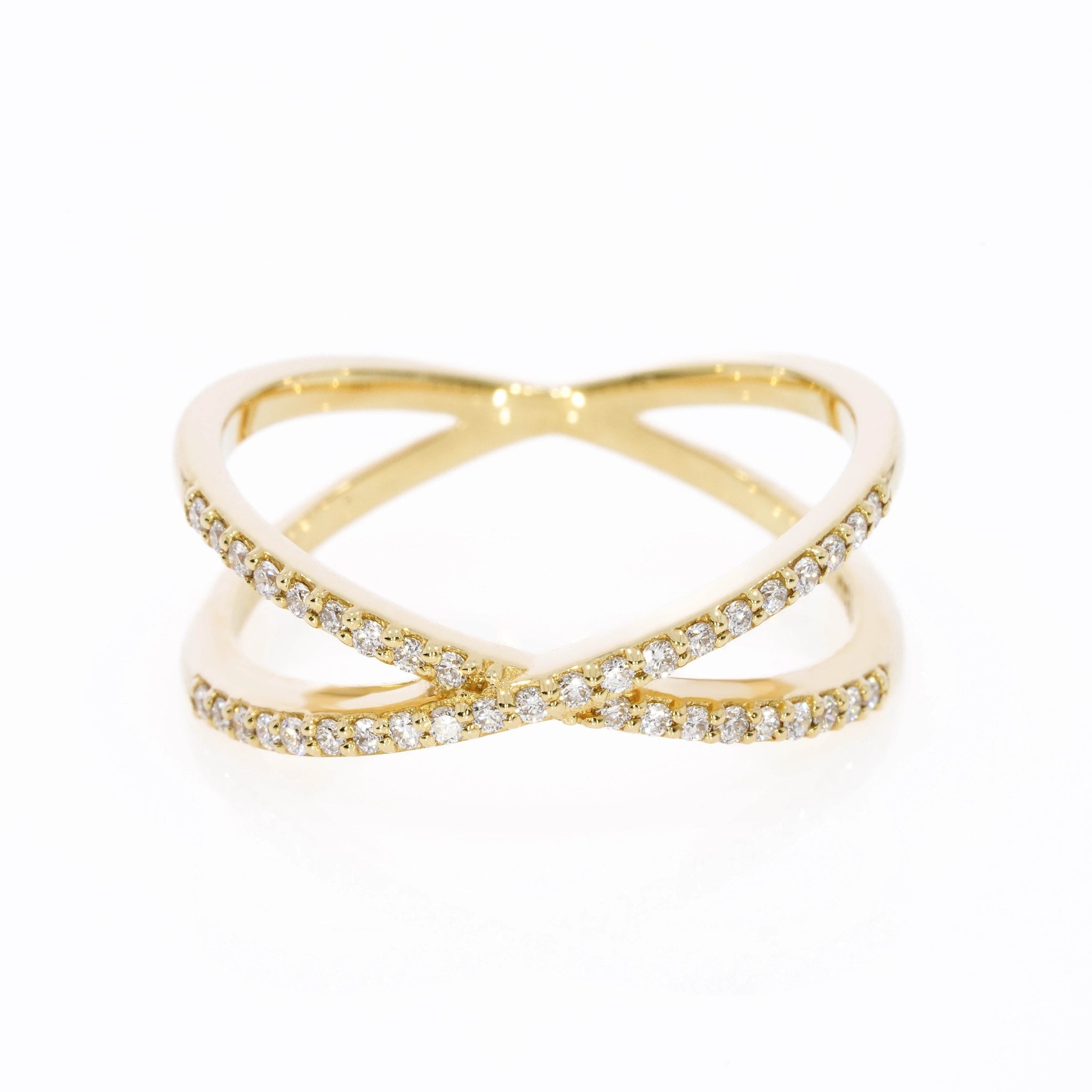 Small criss-cross ring with 0.18cts of bright diamonds, in 18ct gold with stylish bands intersect for a sparkling look.