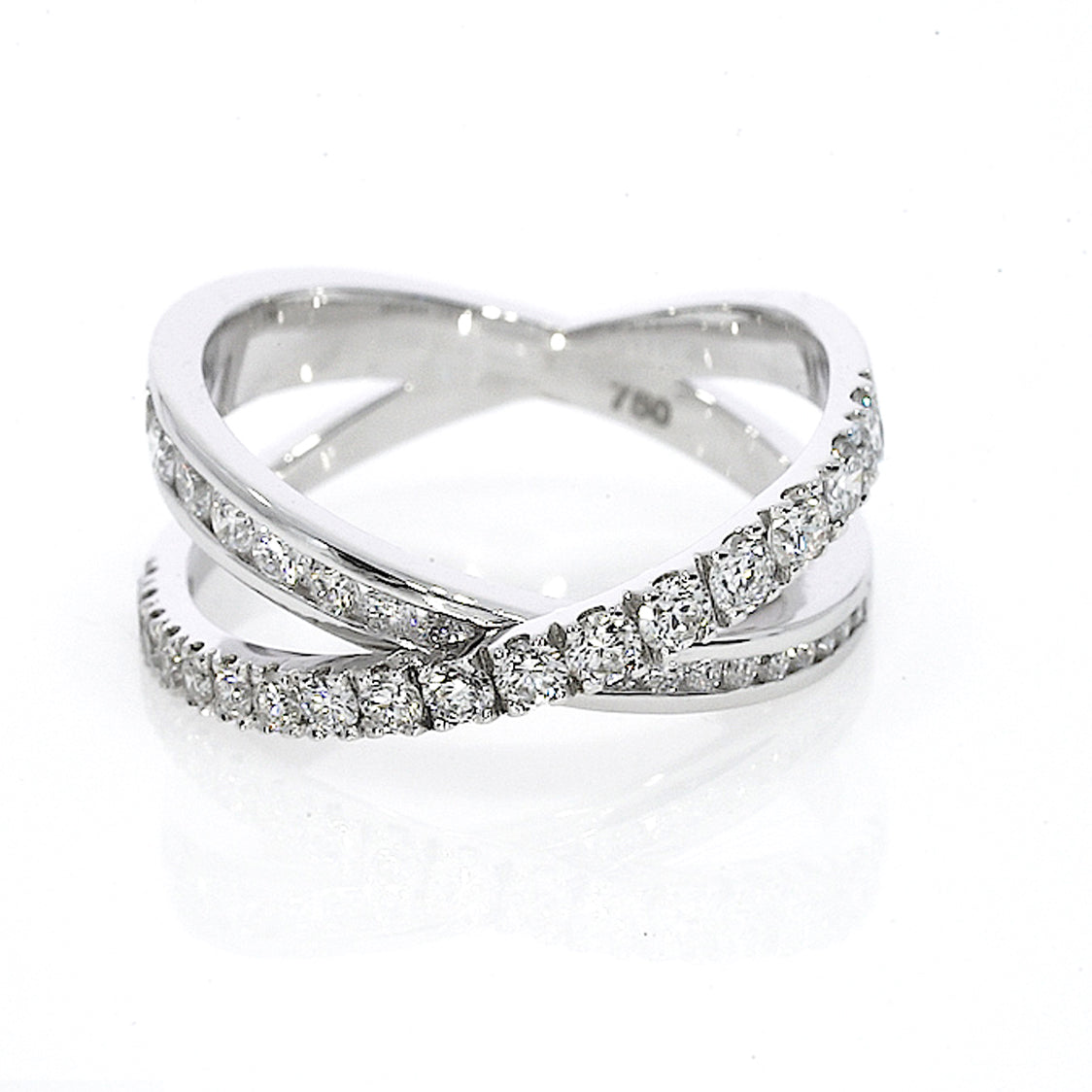 18ct gold criss-cross ring with 0.84cts of claw-set luxury fine diamonds, intersecting bands for a sparkling look.