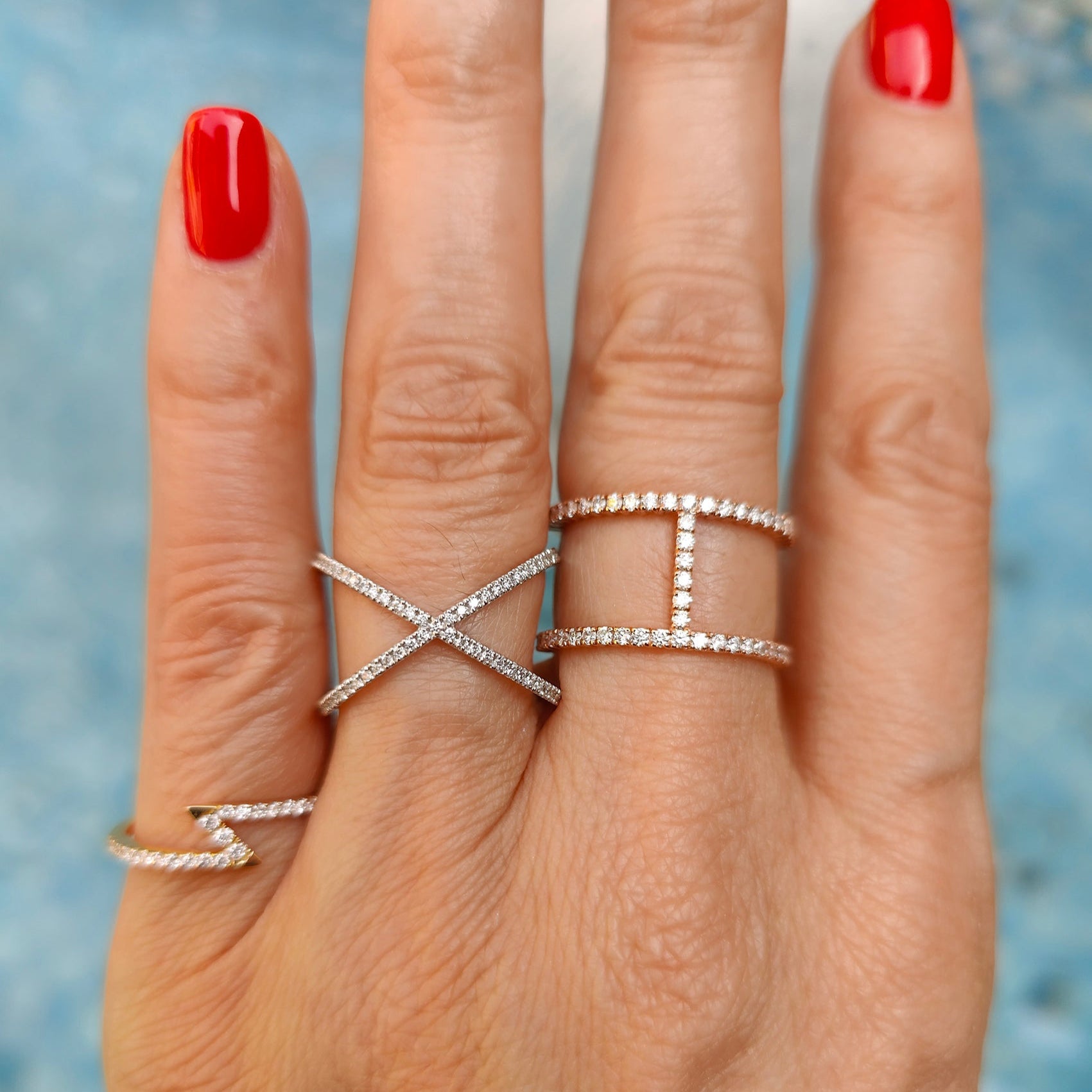 Models wearing diamond rings white gold colour set in 18ct gold.