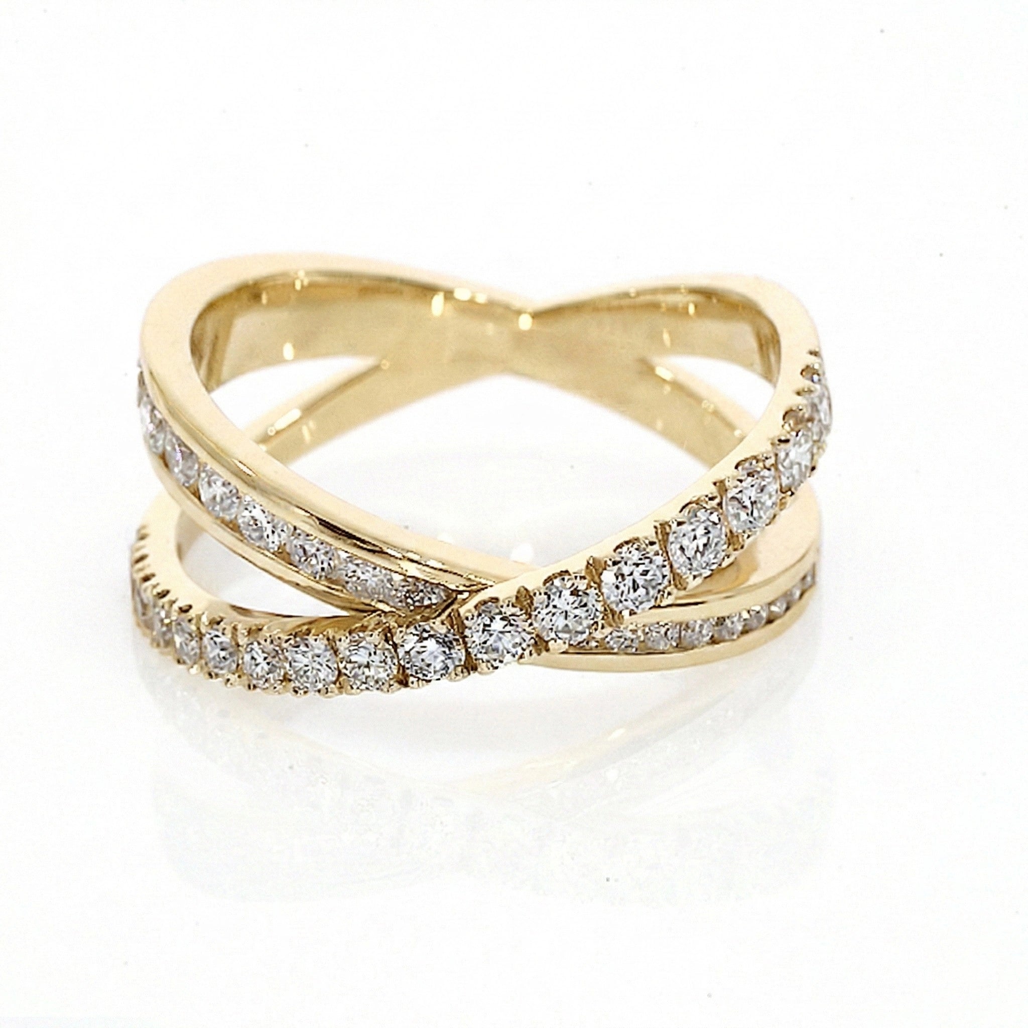 Criss-cross ring large with 0.84cts of claw-set luxury fine diamonds, intersecting bands for a sparkling look set in 18ct gold.