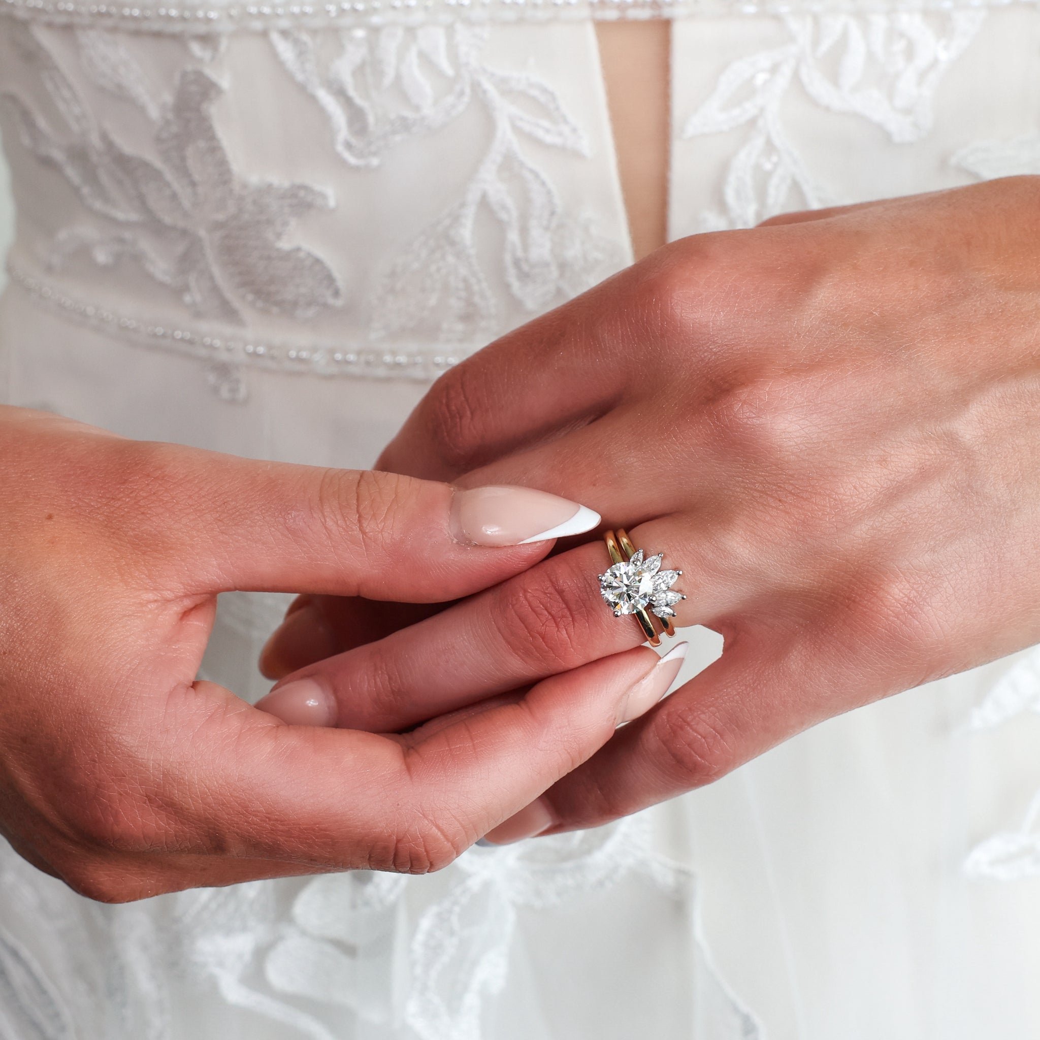 Crown Ring with marquise cut diamonds worn by a bride, showcasing elegance and sophistication.