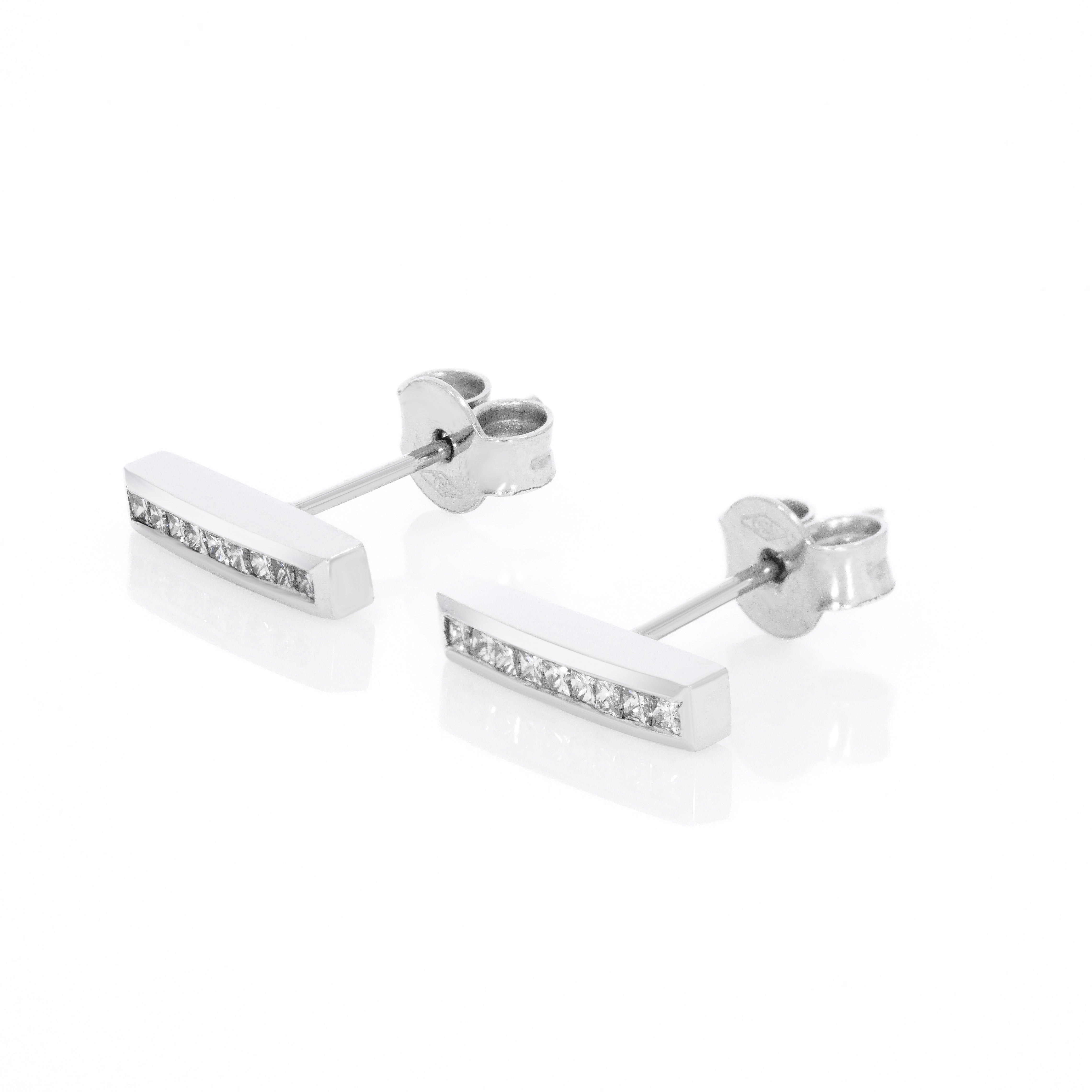 Modern certified diamond earrings with a sleek bar design showcasing sparkling diamonds.