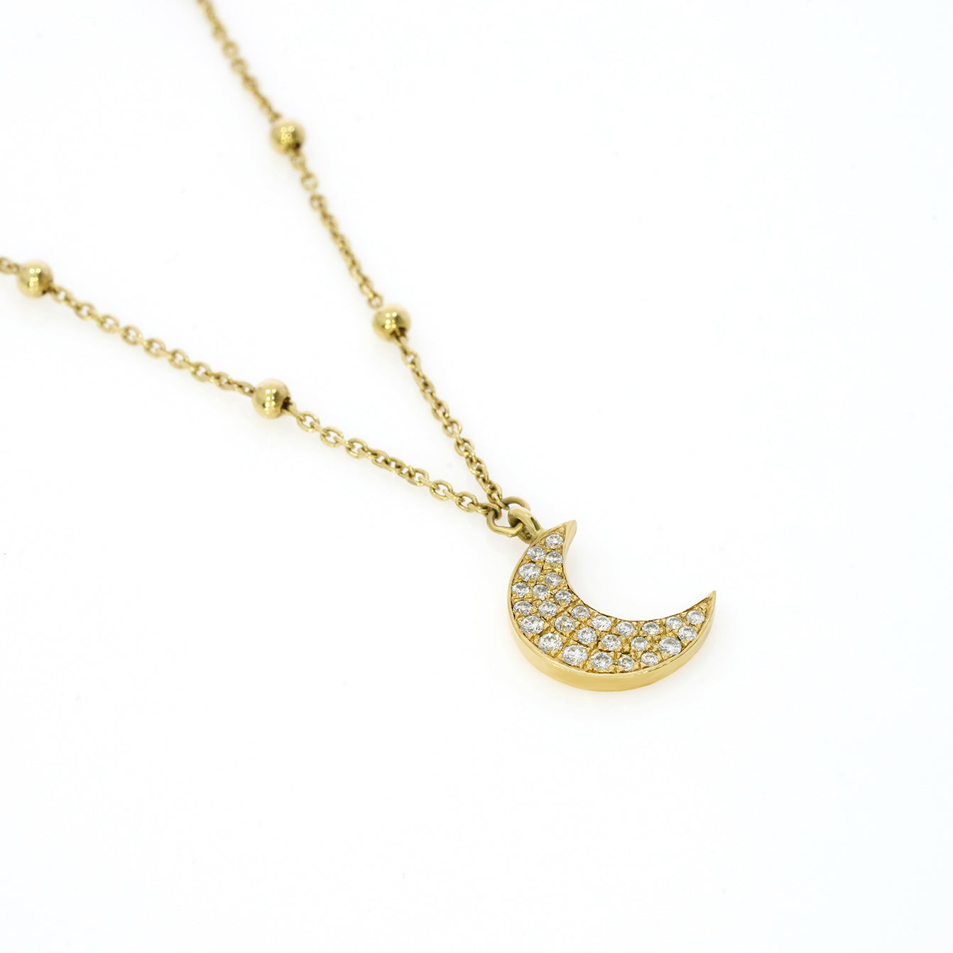 Diamond moon necklace with diamonds on a gold ball chain, showcasing sparkling elegance and modern design.