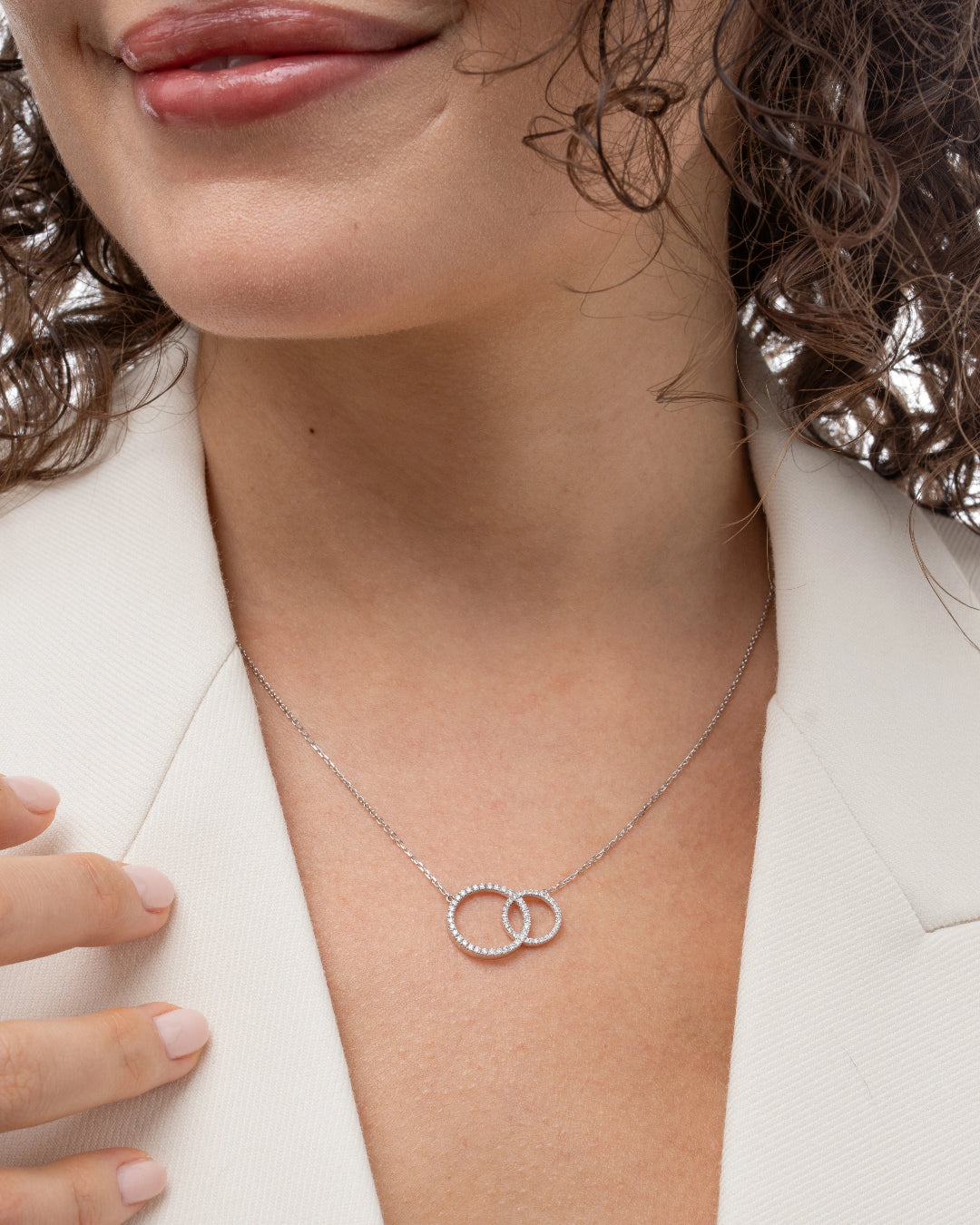 Duo Circle of Life necklace featuring certified diamonds, elegantly worn on a model's neck.