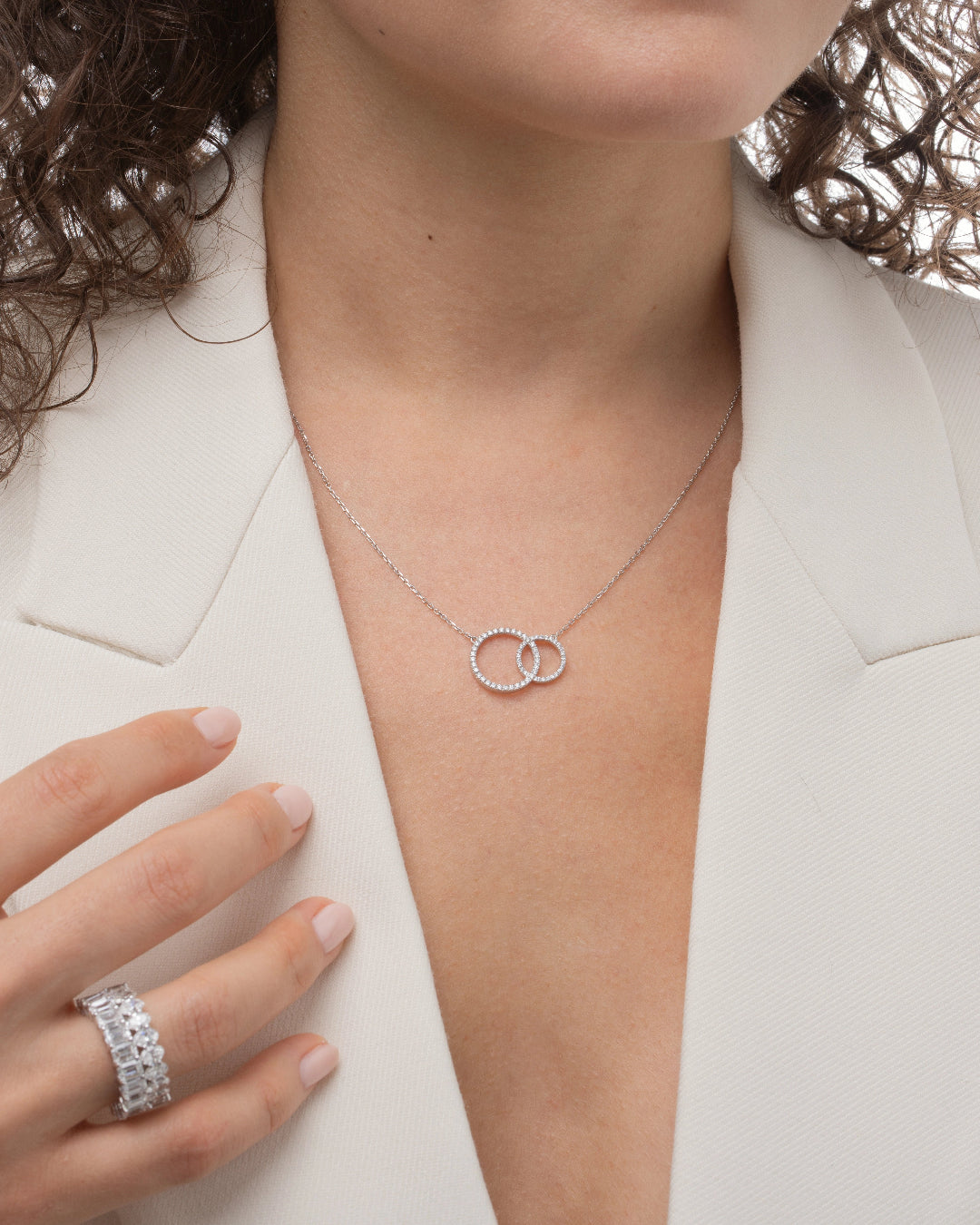 Duo Circle of Life necklace featuring interlocking certified diamonds on a silver chain worn by a model.