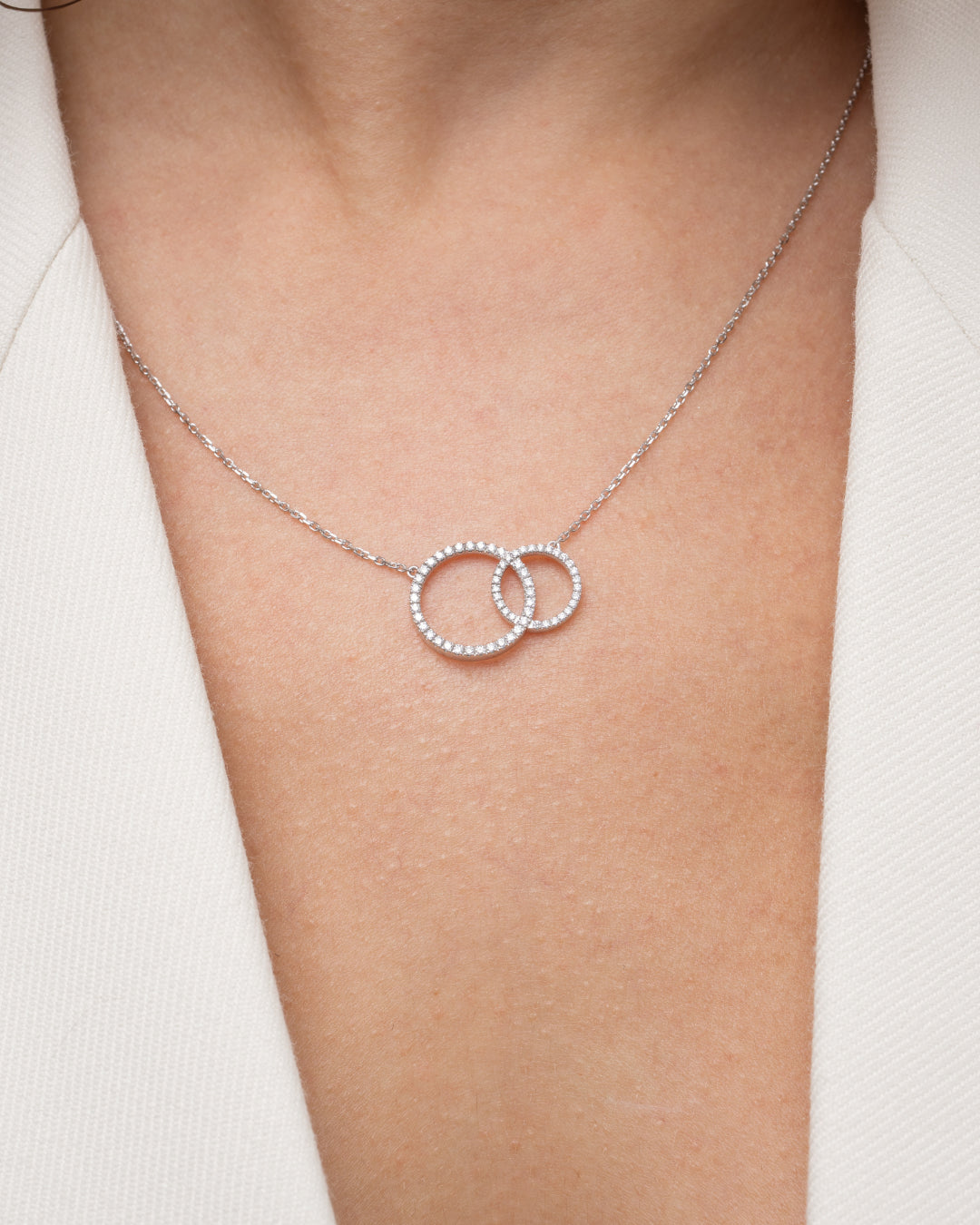 Duo Circle of Life Necklace featuring interlocking certified diamond circles set in 18ct gold with chain options.