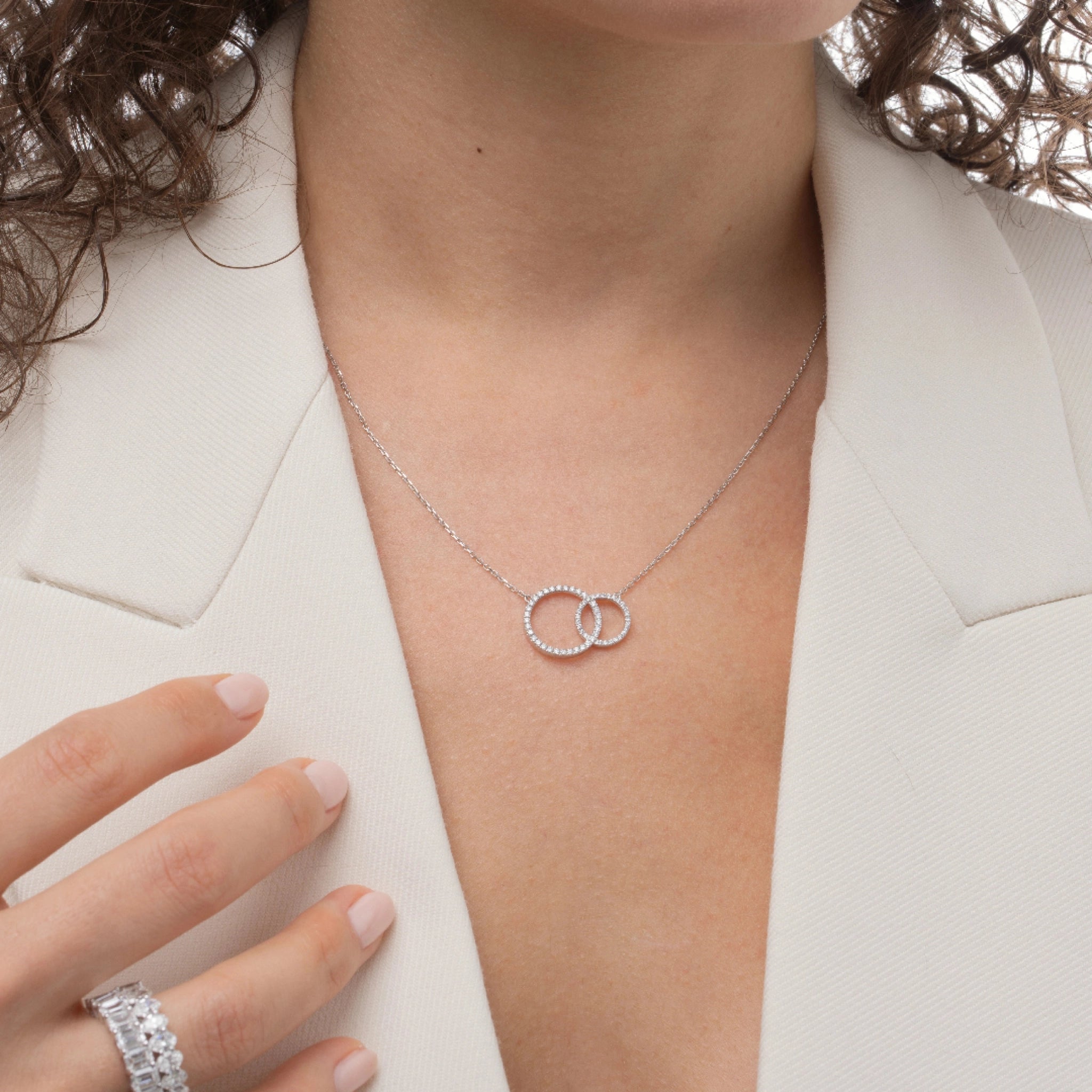 Duo Circle diamond necklace featuring interlocking certified diamonds on a silver chain worn by a model.