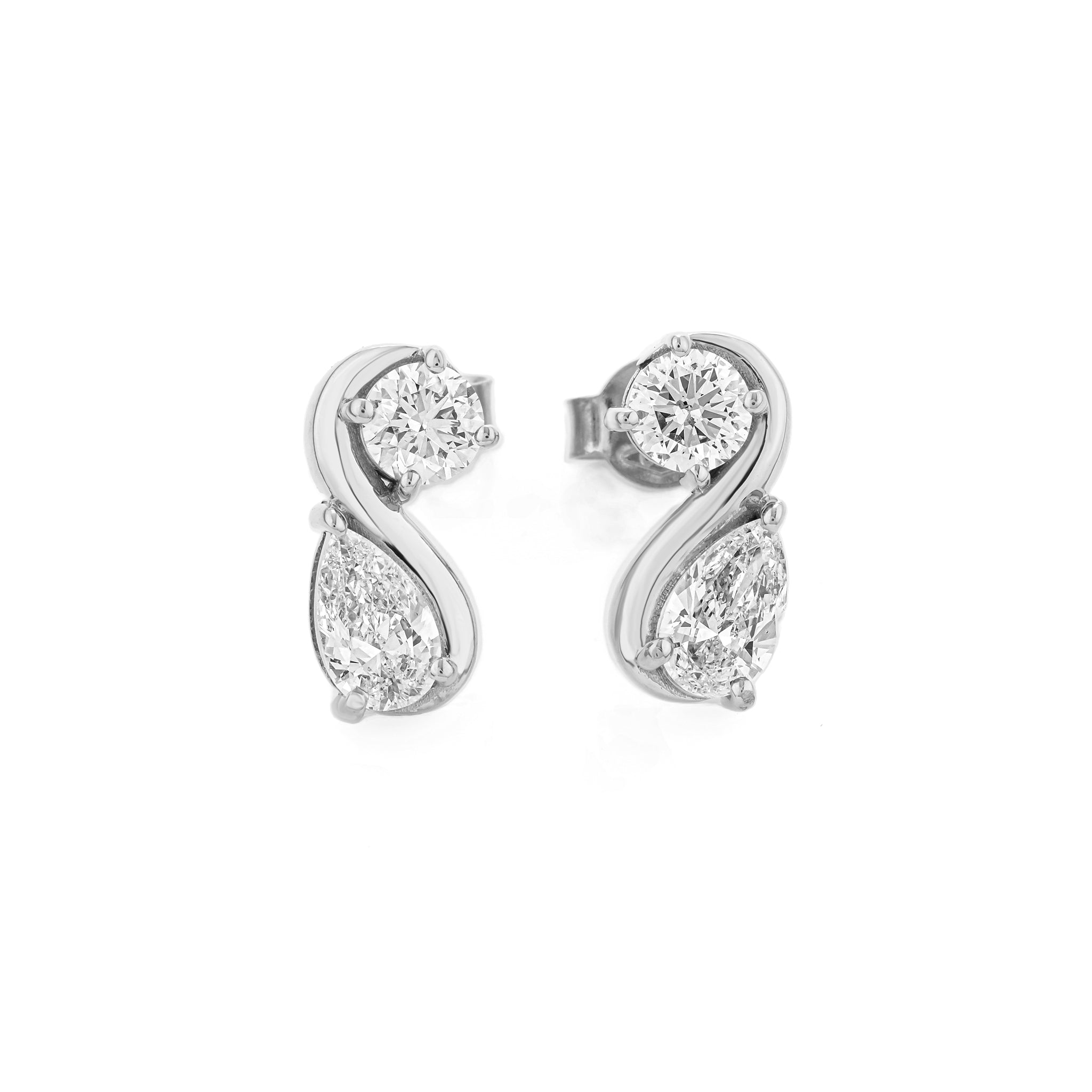 Pair of pear shaped diamond earrings on a white background