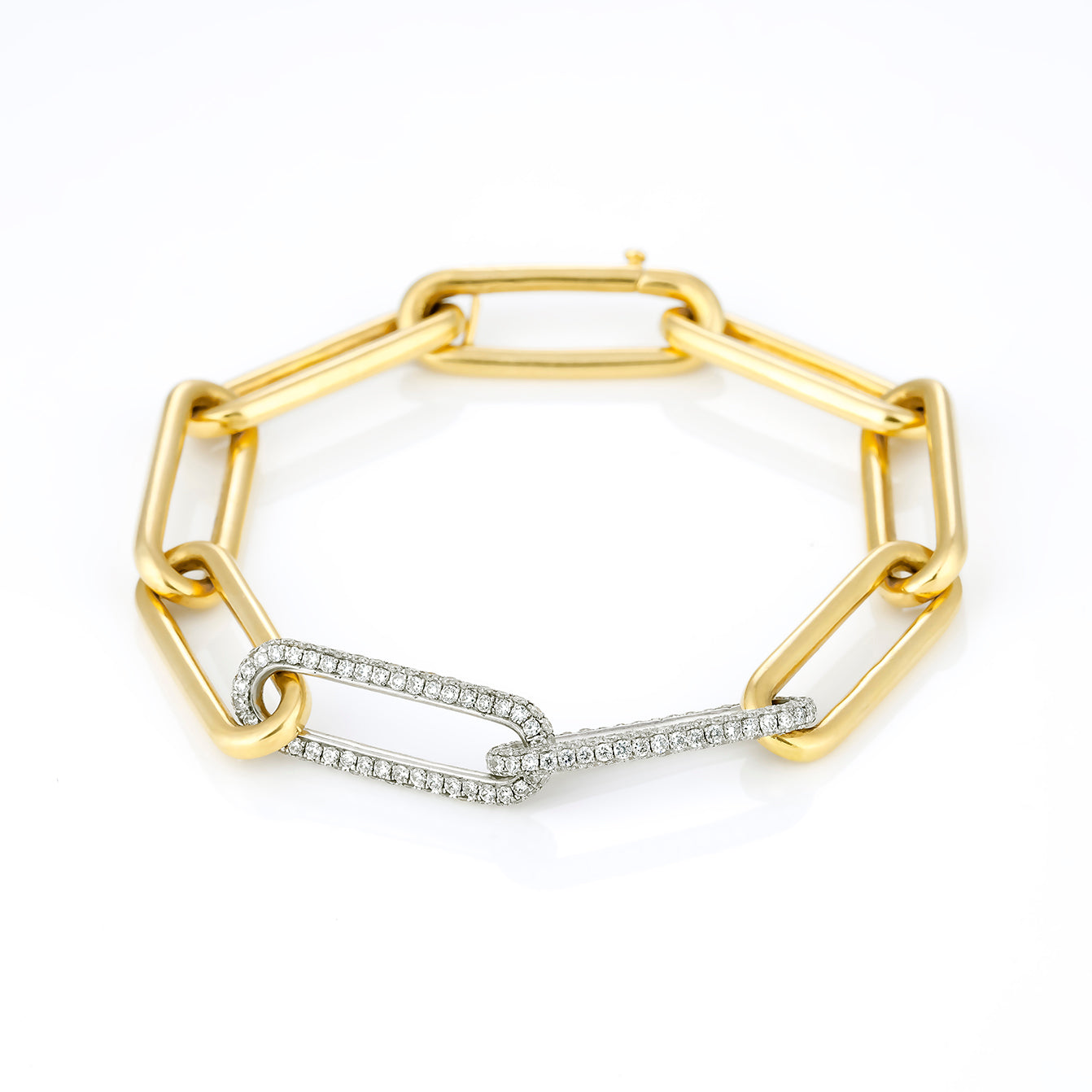 Elegant diamond bracelet featuring yellow and white gold links, adorned with brilliant cut diamonds.