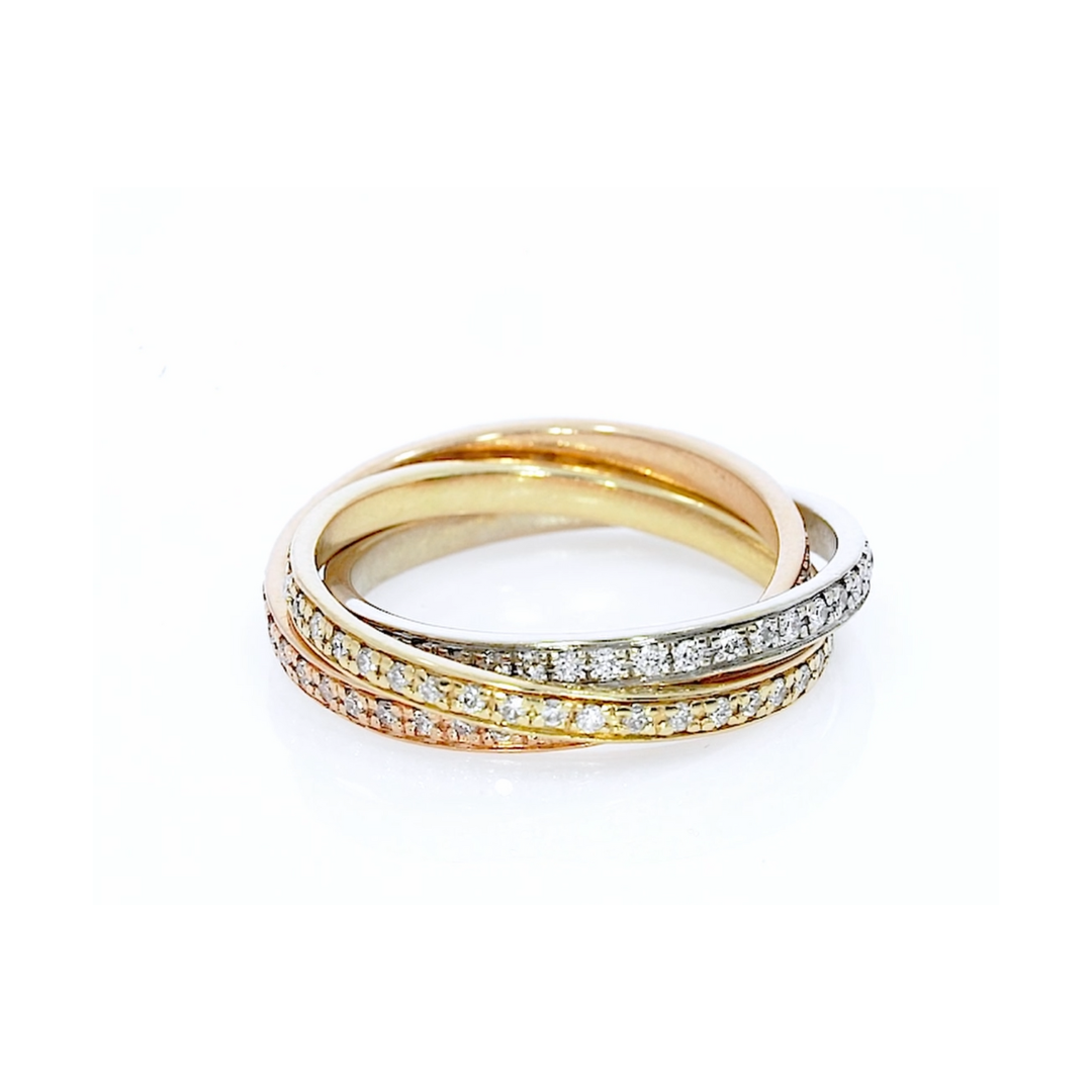 Ring with three rows of diamonds in 18ct white, rose, and yellow gold, featuring bands that move independently in a 'thread' setting.