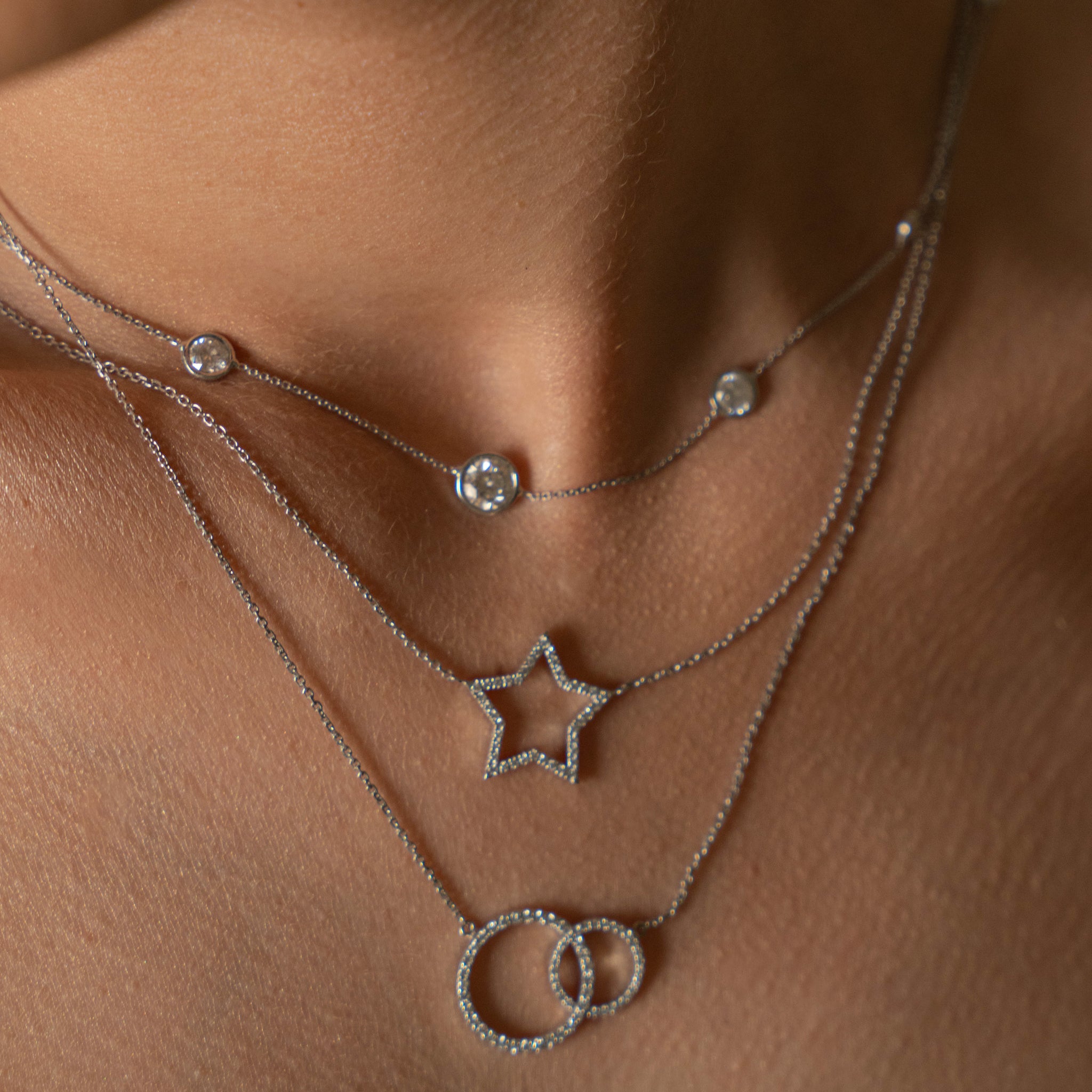Constellation Necklace - Graduating featuring diamonds in delicate settings, perfect for a glamorous look with diamond earrings.
