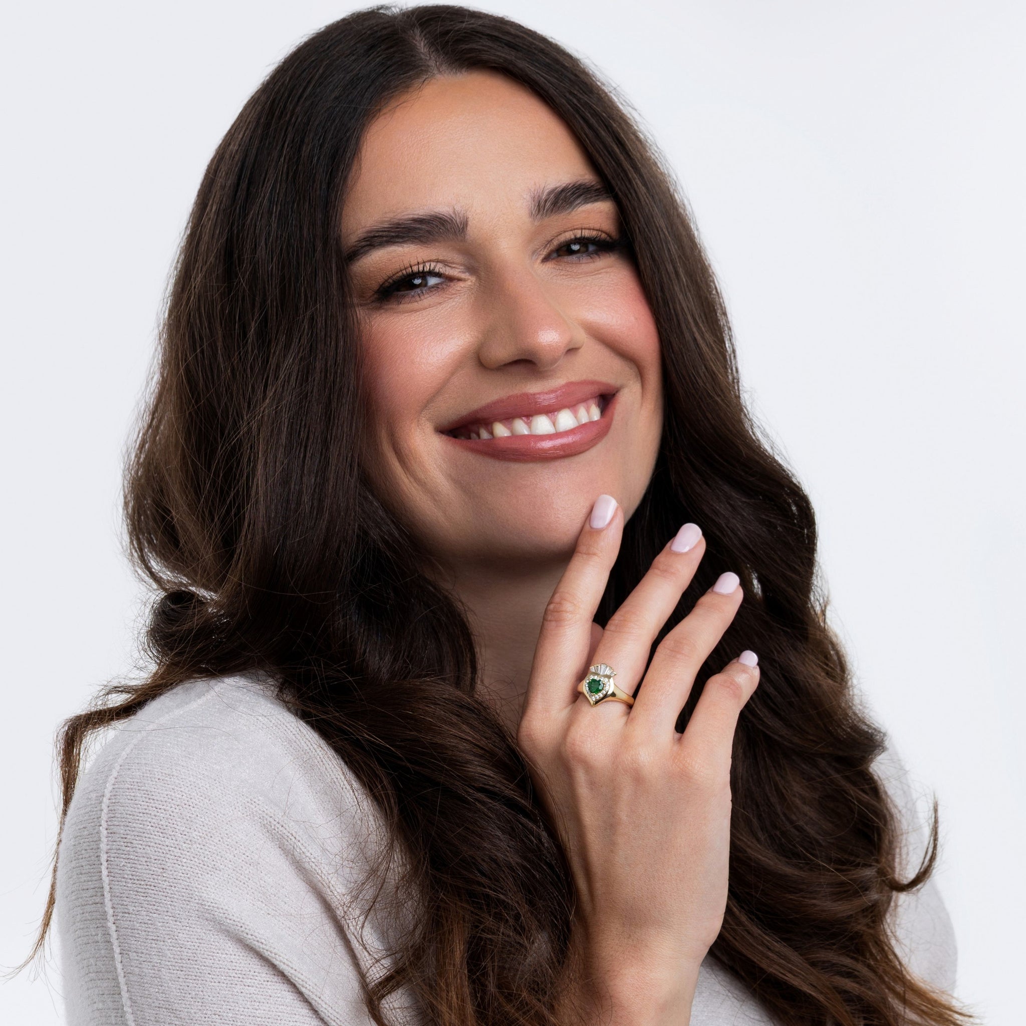 Woman wearing a stylish Claddagh ring, showcasing Ireland's heritage and modern elegance.