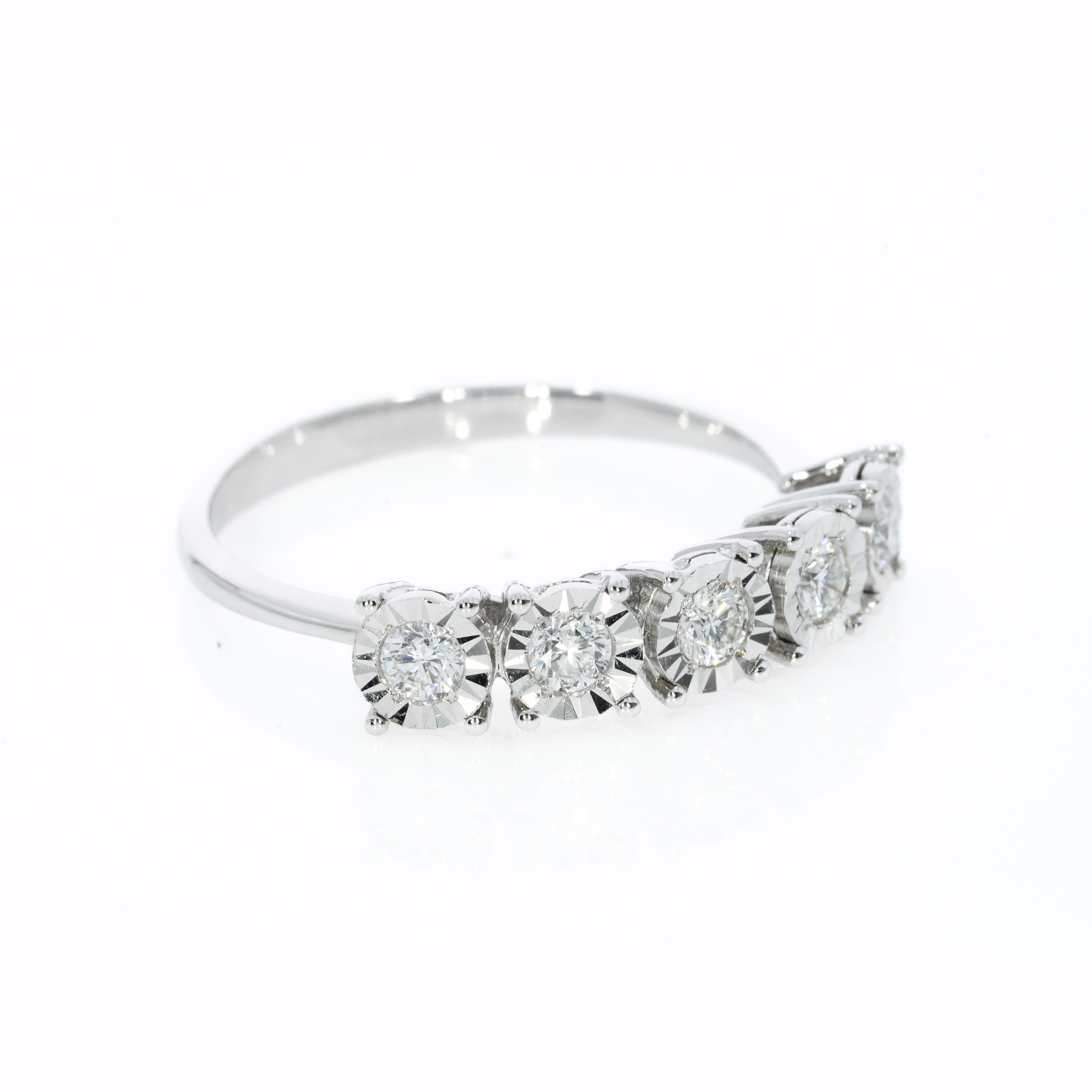 Illusion Five Stone Eternity Ring with five diamonds in a setting that makes each appear larger and adds extra sparkle.