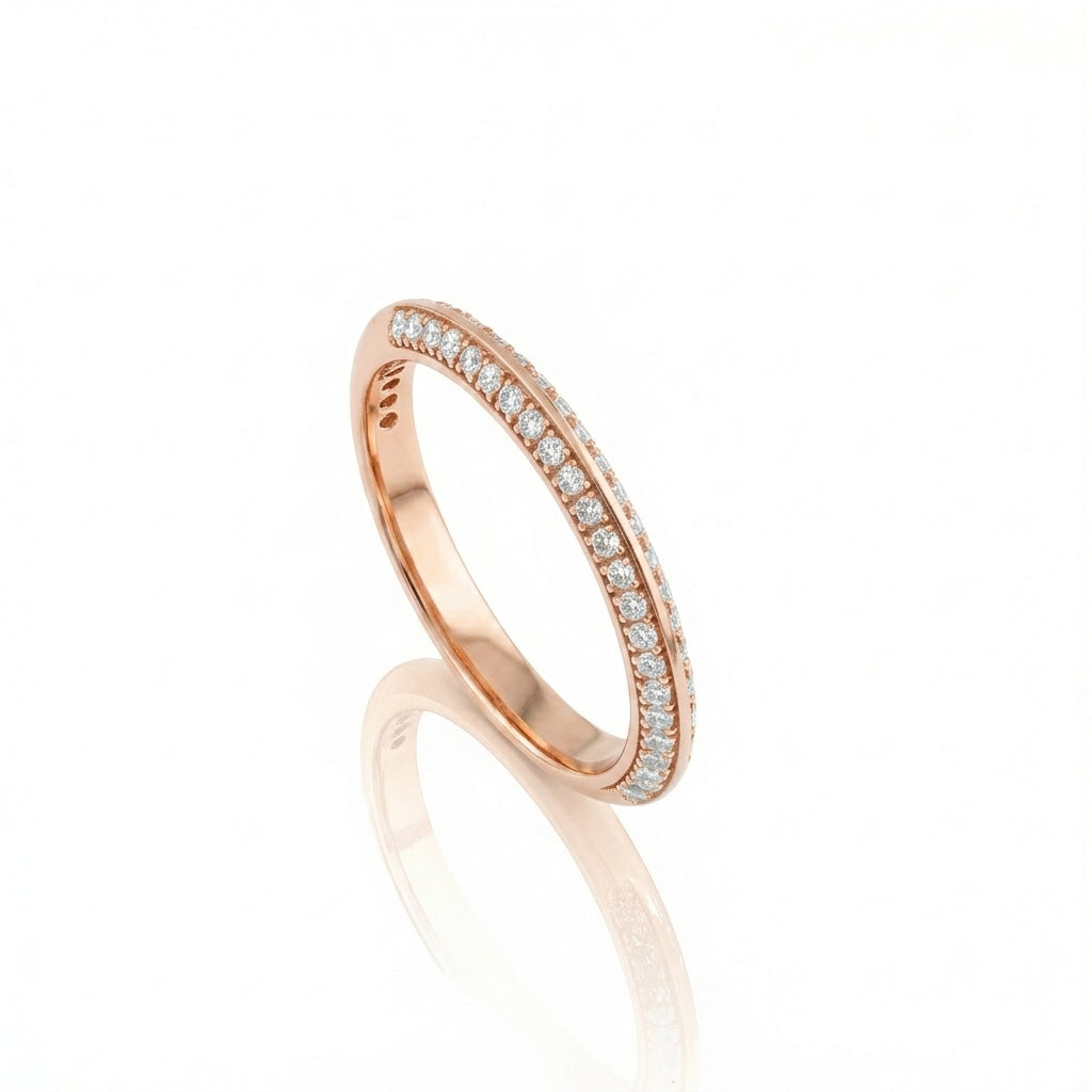 Knife Edge Wedding Band in 18ct rose gold with diamond pavé setting showcasing a sharp architectural silhouette.