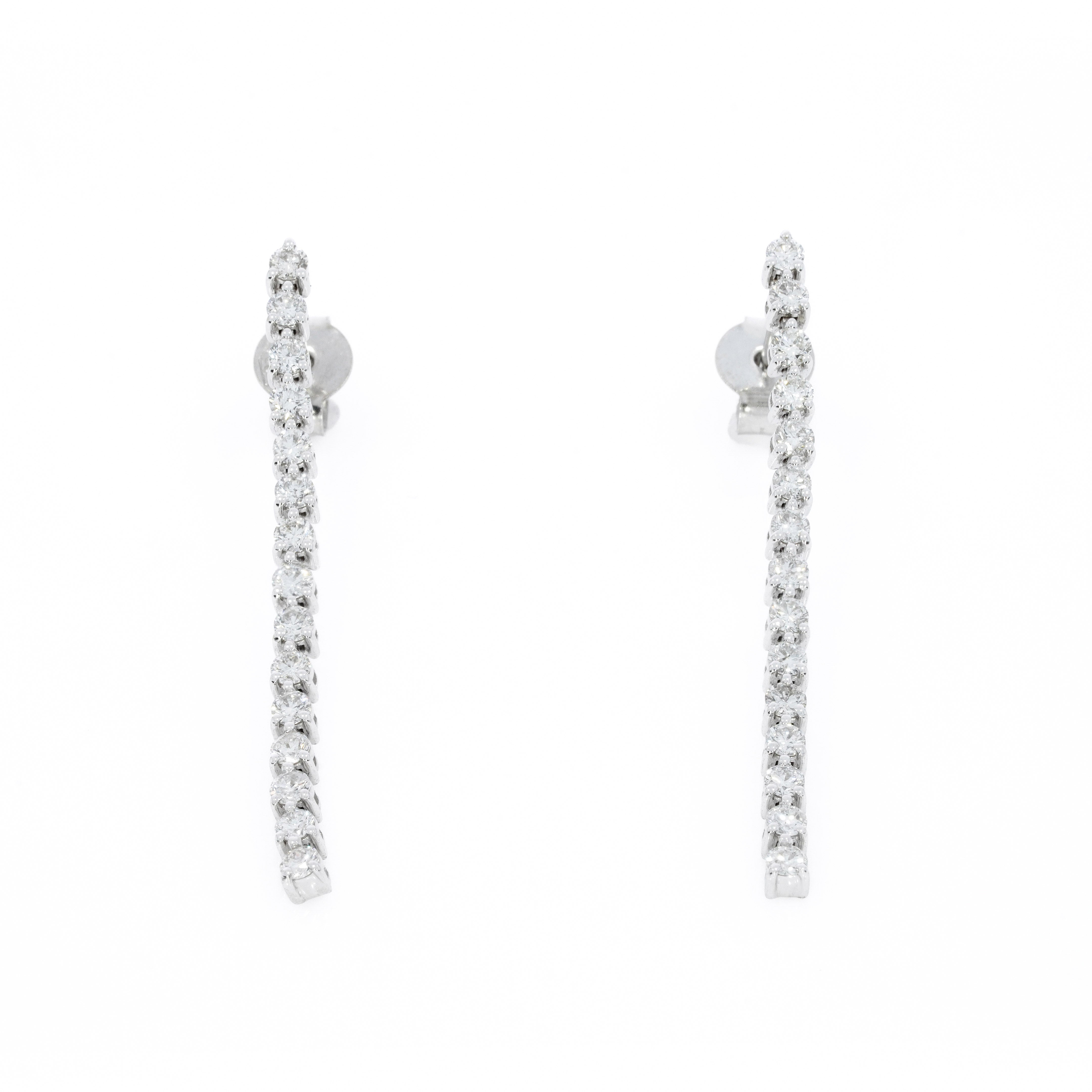 Elegant Diamond Line earrings featuring diamonds set in solid gold, perfect for any occasion.