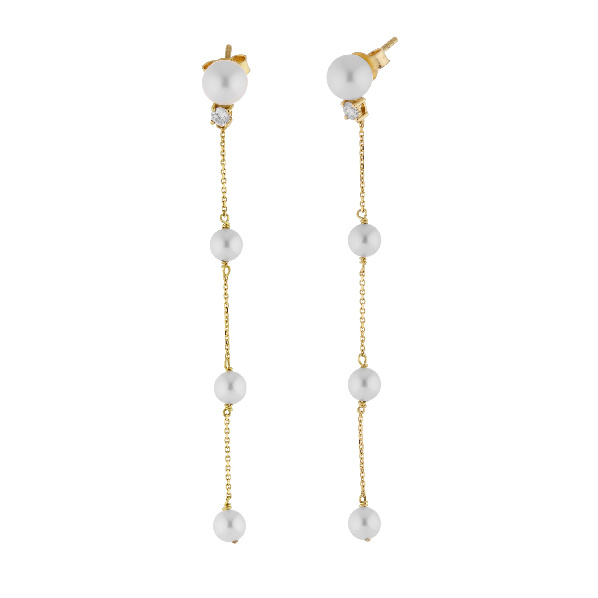 A pair of gold drop earrings with white pearl beads and a small diamond at the top, shown against a plain white background.