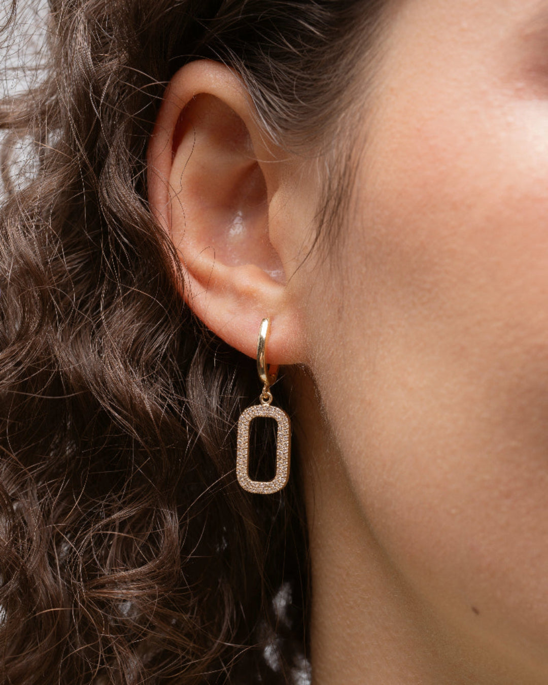 Elegant gold drop earrings showcasing certified diamond detail, perfect for adding sparkle to any outfit.