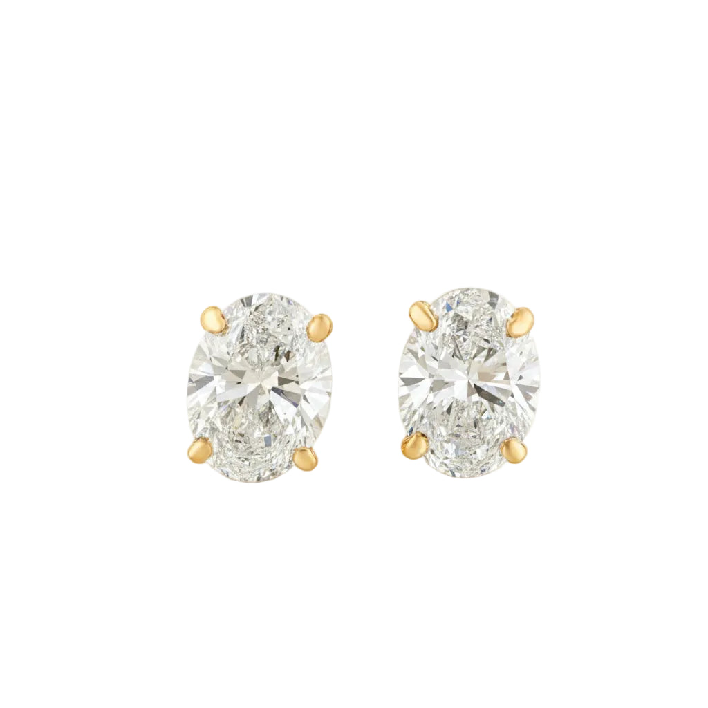 Pair of diamond stud earrings on a white background