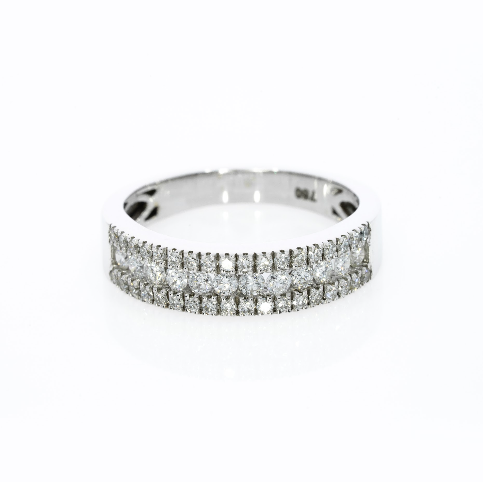 A delicate three-row pave diamond ring with 0.57cts diamonds, set in 18ct gold for optimal brilliance.
