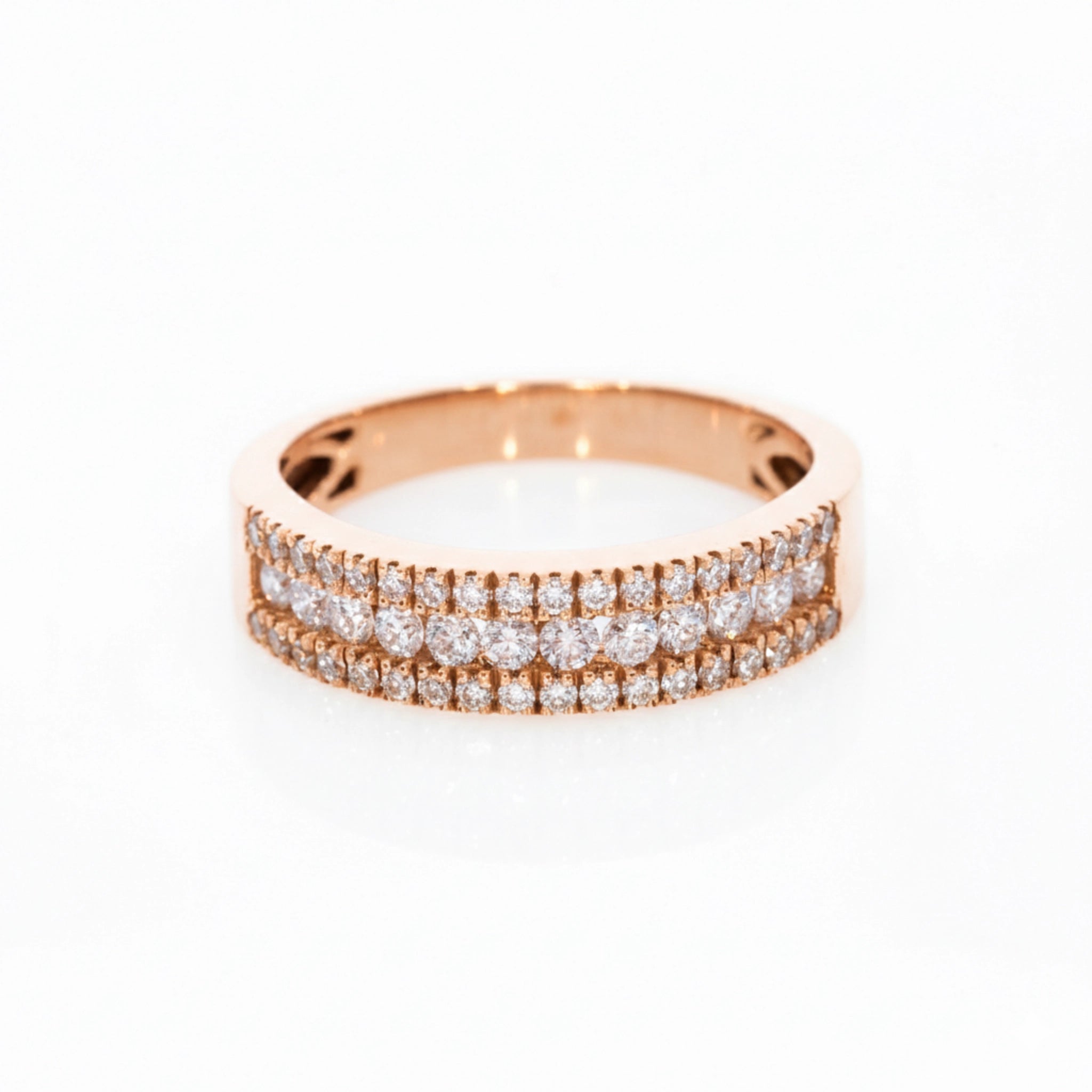 A delicate three-row pave diamond ring with 0.57cts diamonds, set in 18ct rose gold for optimal brilliance.