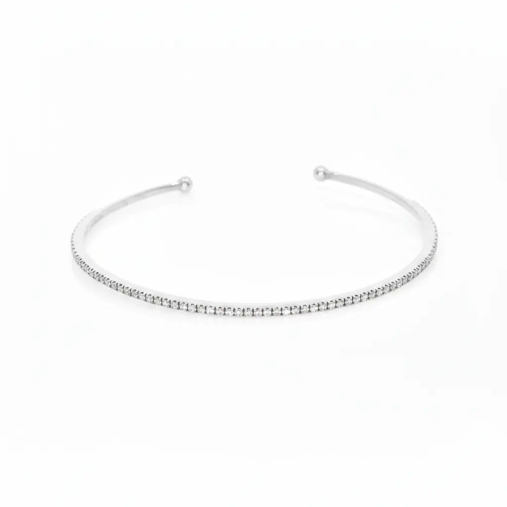 Elegant push-on tennis bangle in 18ct white gold featuring diamonds, ideal for stacking with other bracelets.