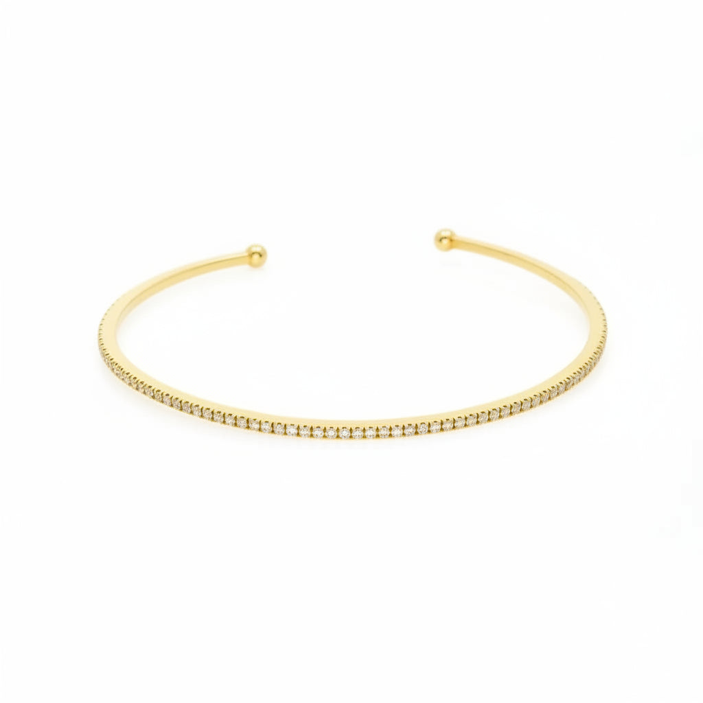 Elegant push-on tennis bangle in 18ct yellow gold featuring diamonds, ideal for stacking with other bracelets.