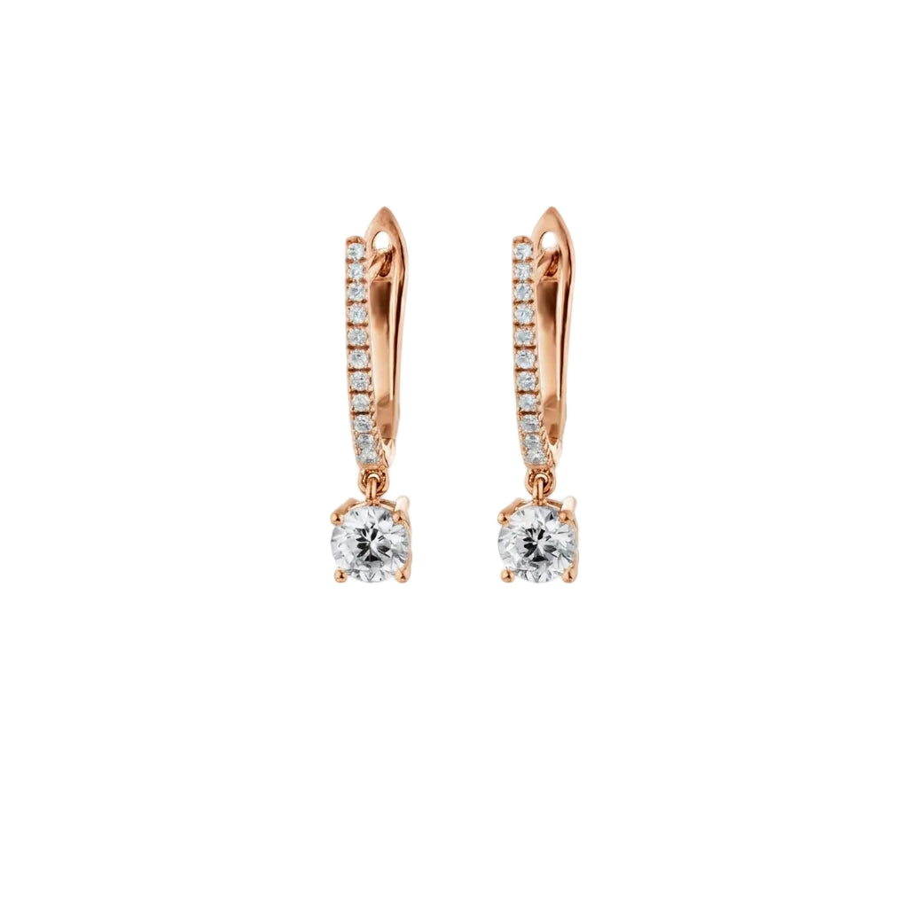 Rose gold hoop earrings with diamonds on a white background