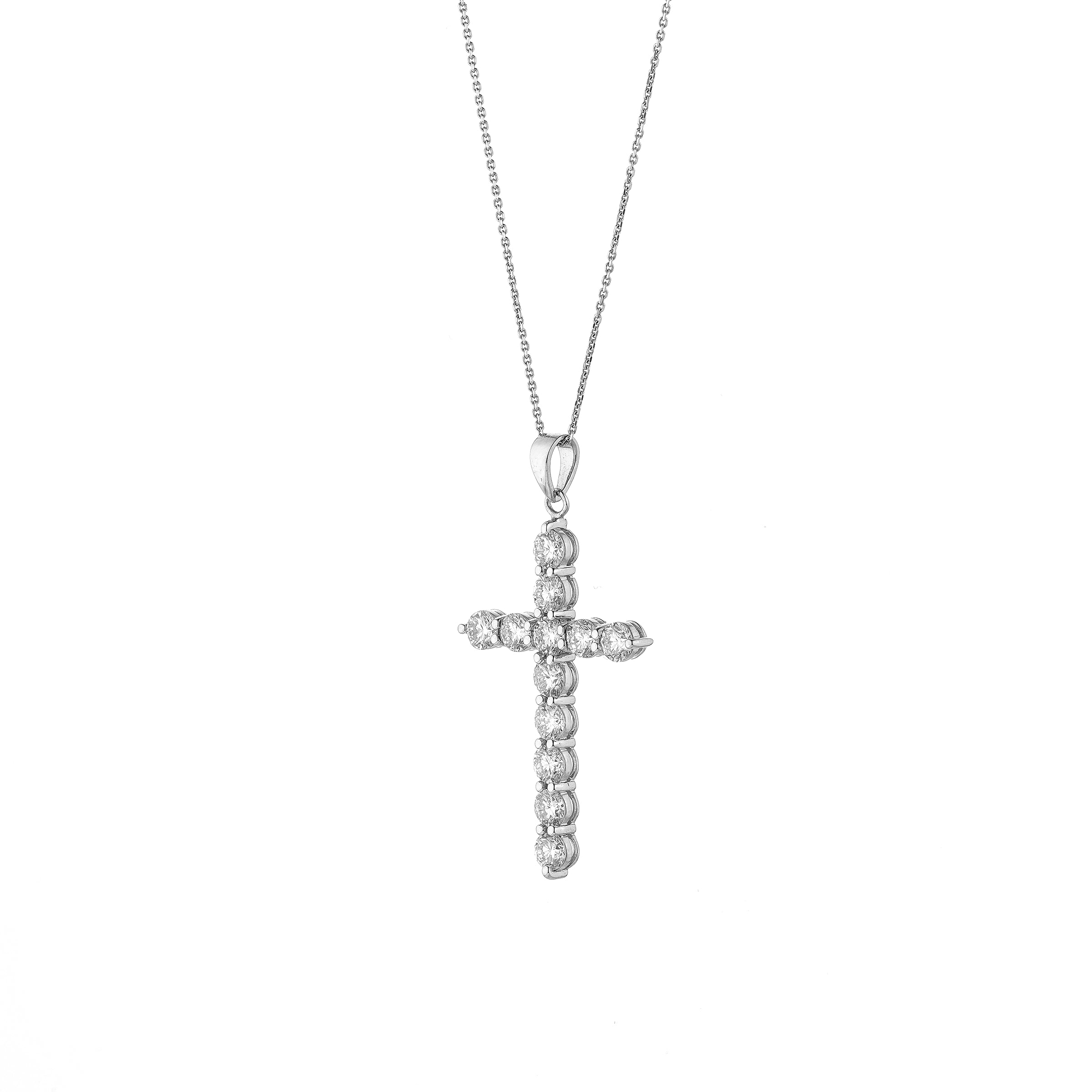White gold diamond cross pendant necklace on a white background
