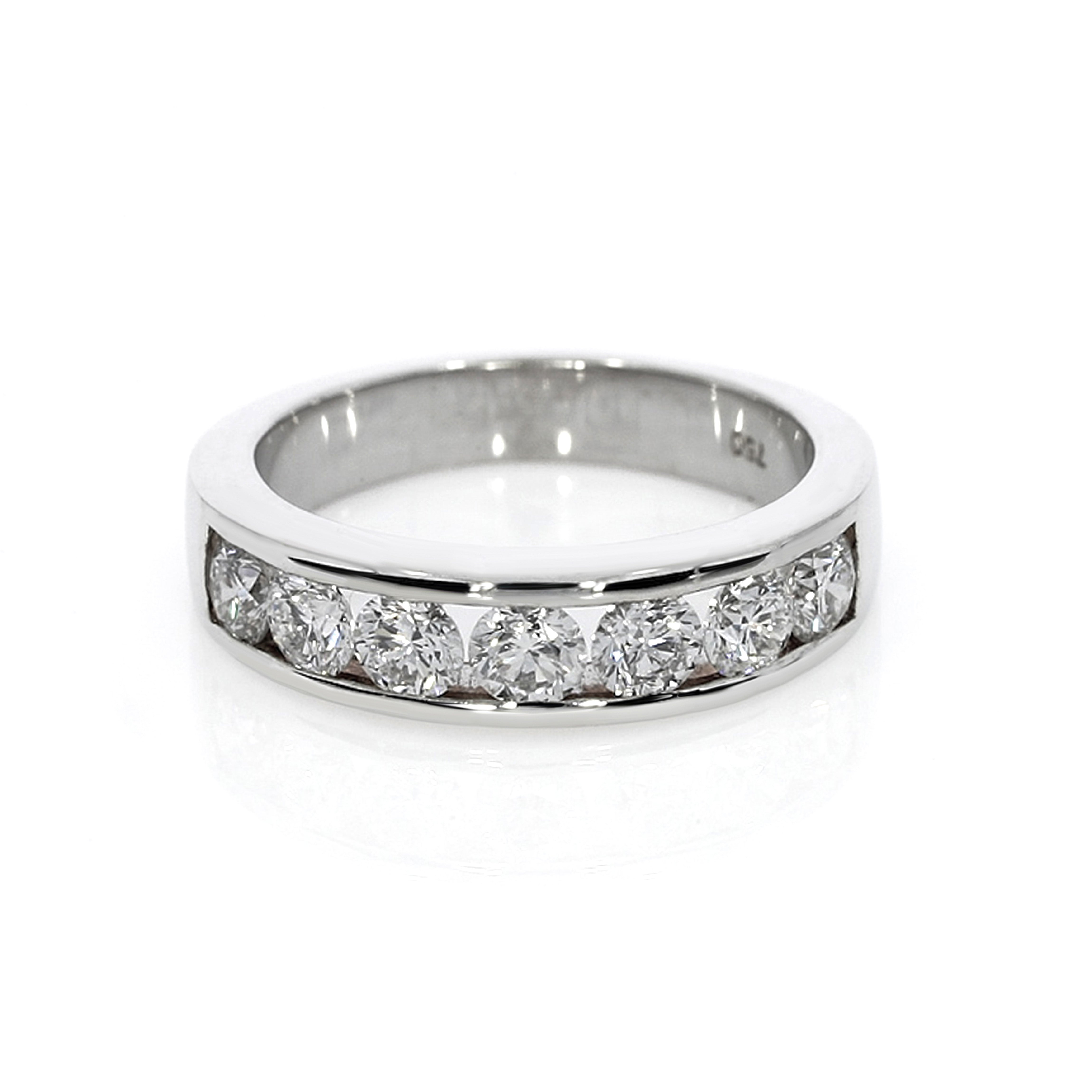 Modern design ring with seven round brilliant cut diamonds in a channel setting.