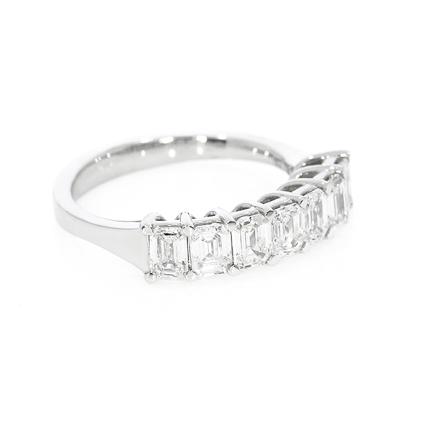 Timeless emerald cut eternity ring in white gold, featuring 1.46 carats of F-G color and VS-SI clarity emerald cut diamonds.