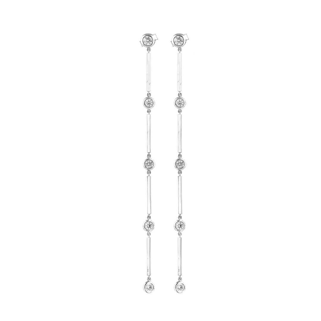 Elegant Cascade Diamond Earrings in 18ct white gold showcasing a shimmering drop of bezel set diamonds.