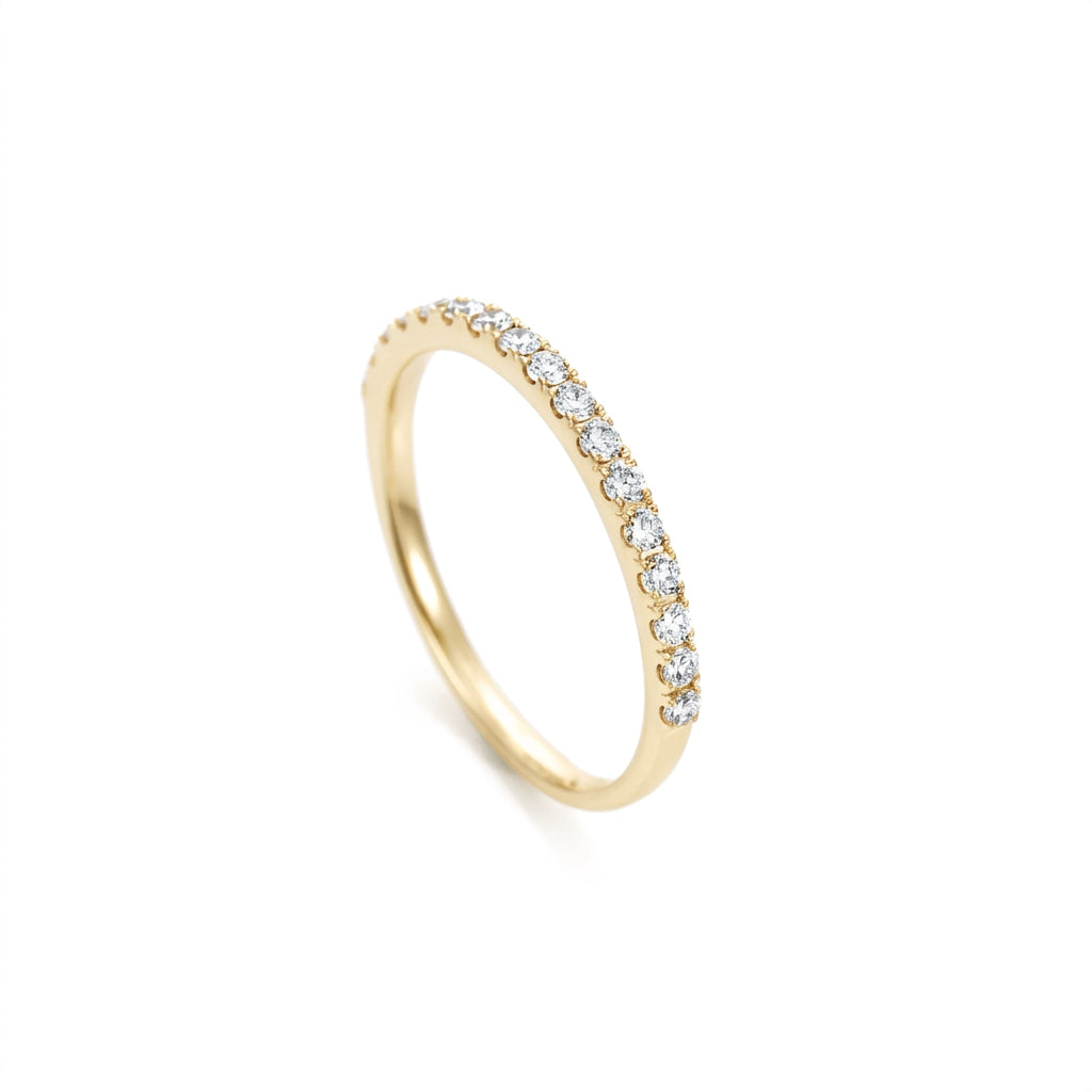 Yellow Gold ring with small diamonds on a white background