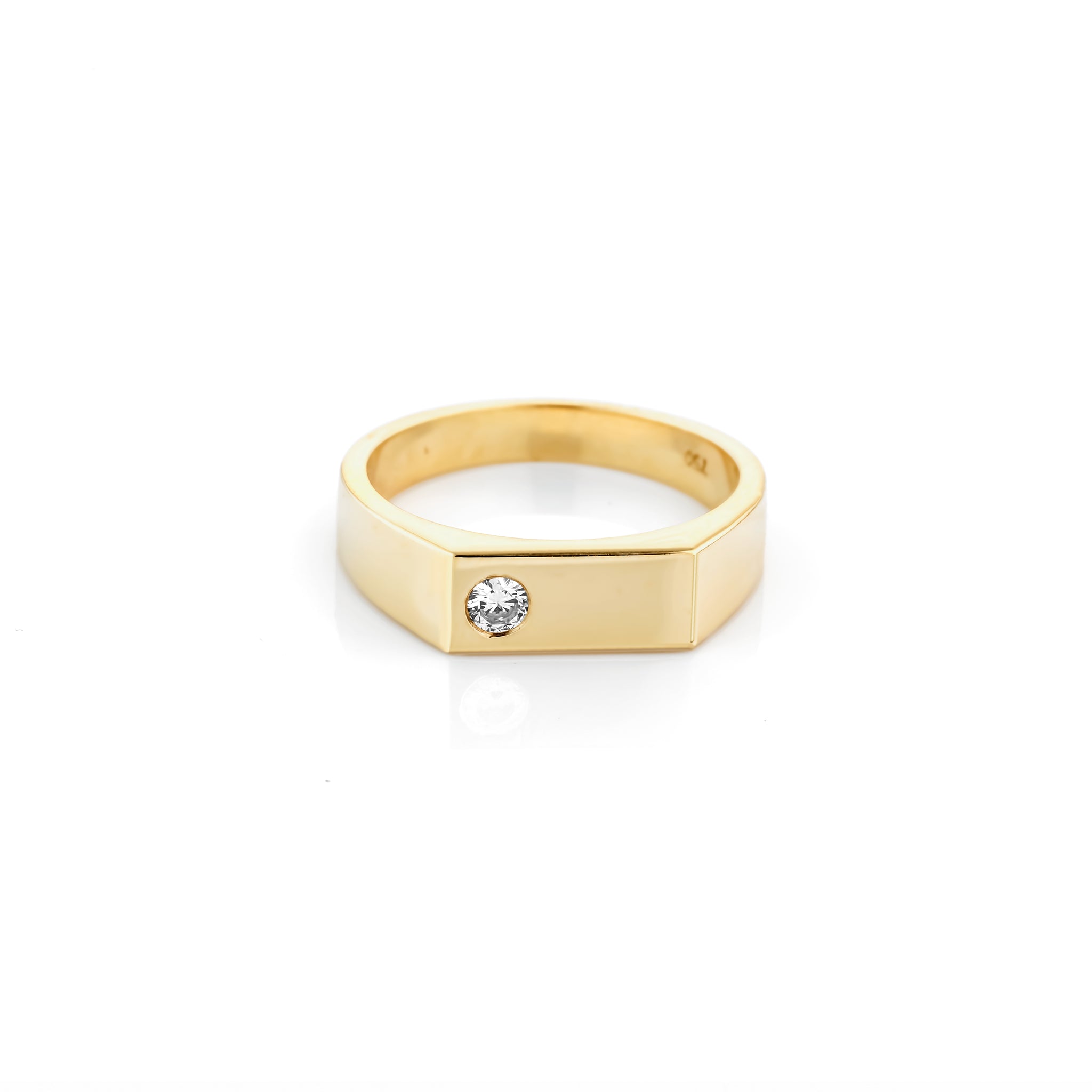 Gold ring with a diamond on a white background