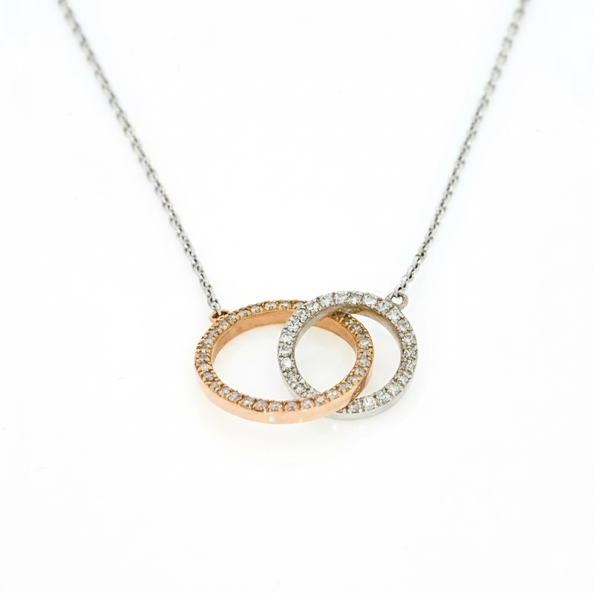 Circle Around The Sun necklace featuring interlocking diamond circles in 18ct rose gold set with F-G colour diamonds.