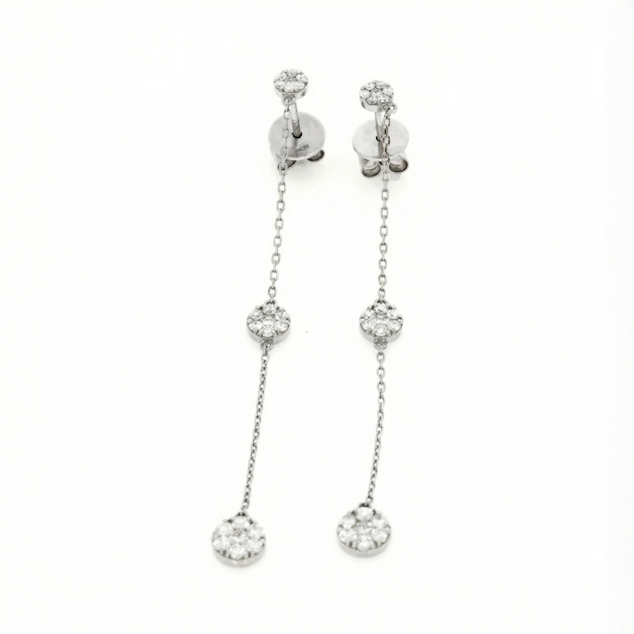 Elegant drop illusion earrings featuring certified diamond earrings in 18ct white gold with diamond clusters